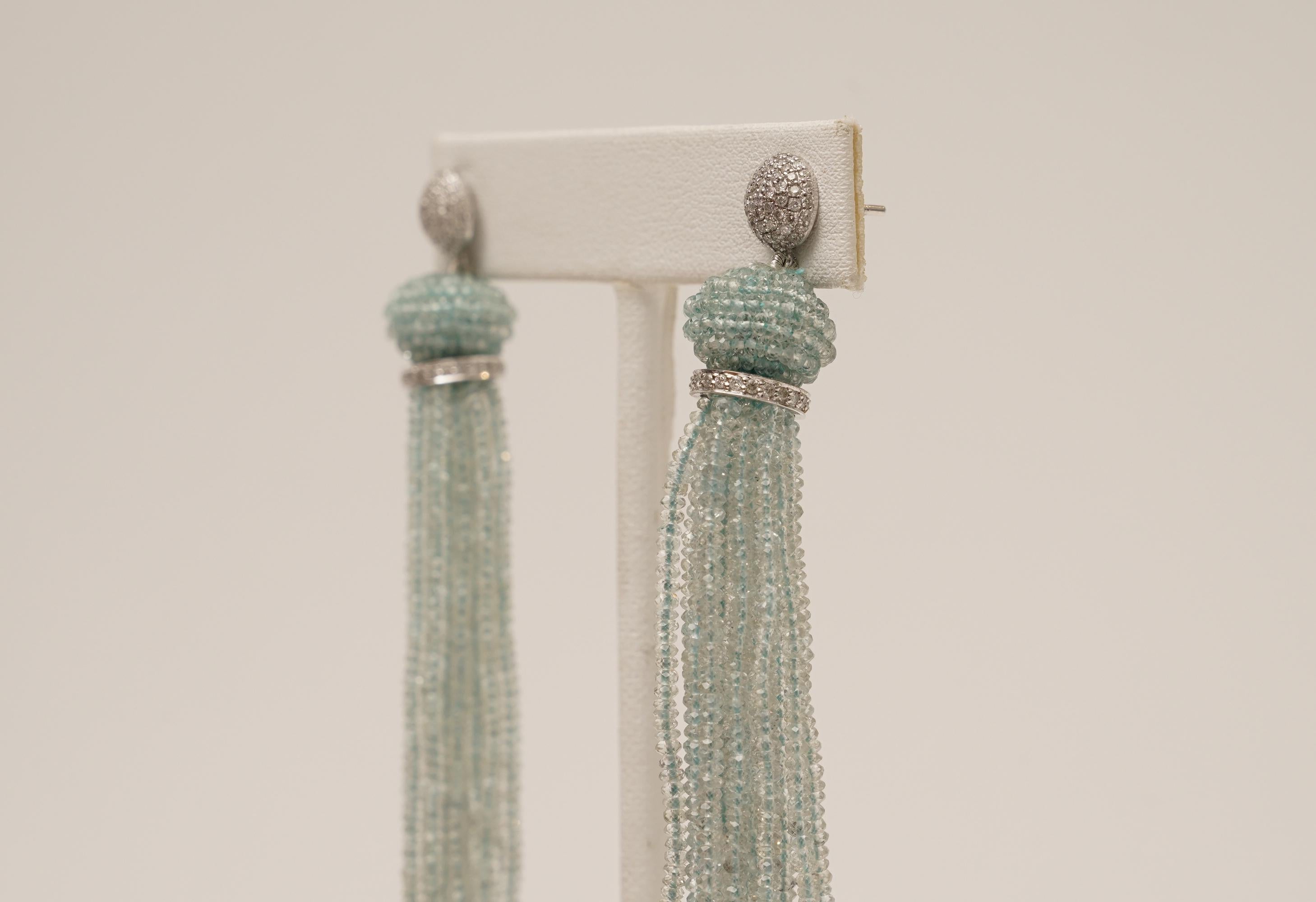 A pair of faceted aquamarine dangle tassel earrings with hand-woven aquamarine bead at the top with pave`-set diamond rondelle and earring post set in 18K white gold.  For pierced ears. Designed by Deborah Lockhart Phillips