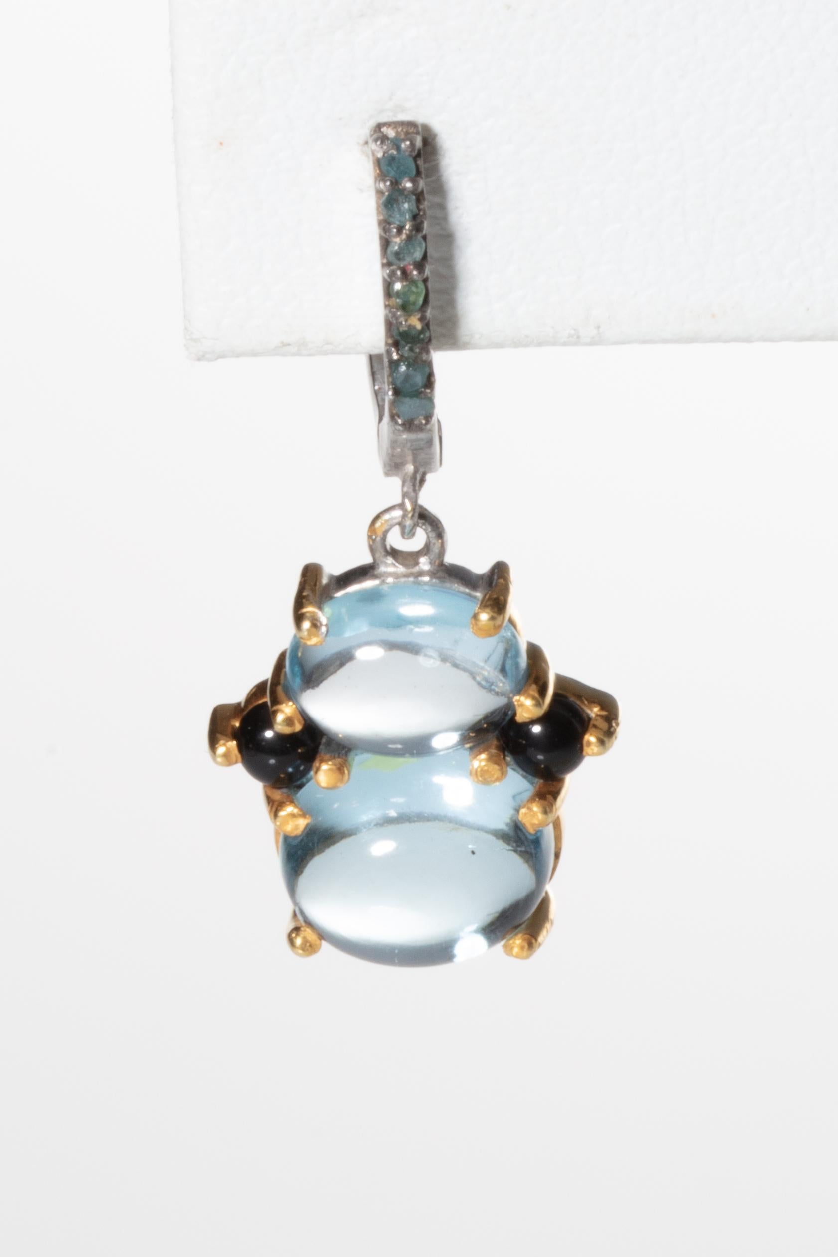 Double-drop cabochon aquamarine earrings flanked by two cabochon sapphires held with 18K gold bezels on a sterling frame.  The post is a loop of pave`-set diamonds on a sterling French clip for pierced ears.  Weight of diamonds is 1 carat and the