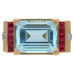Aquamarine, diamond and synthetic ruby cocktail ring, circa 1945.