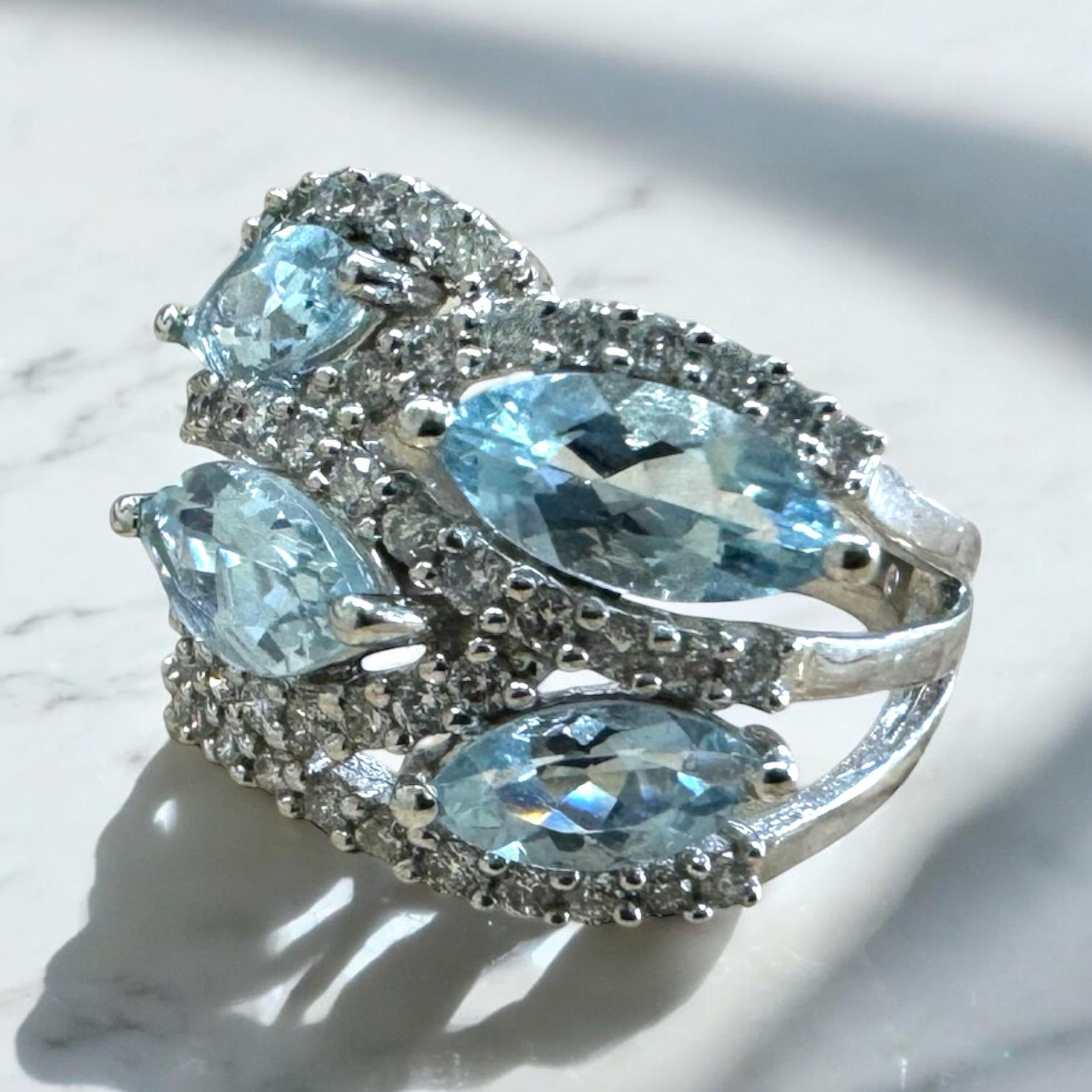 We are loving the unique combination of marquise cut aquas & diamonds!!

Ring Details
Material: 14K White Gold
Head Width: 16mm
Head Height: 3.5mm
Shank Width: 3.25mm
Weight: 7.8 Grams
Finger Size: 7
Sizable Upon Request

Accented by the following
