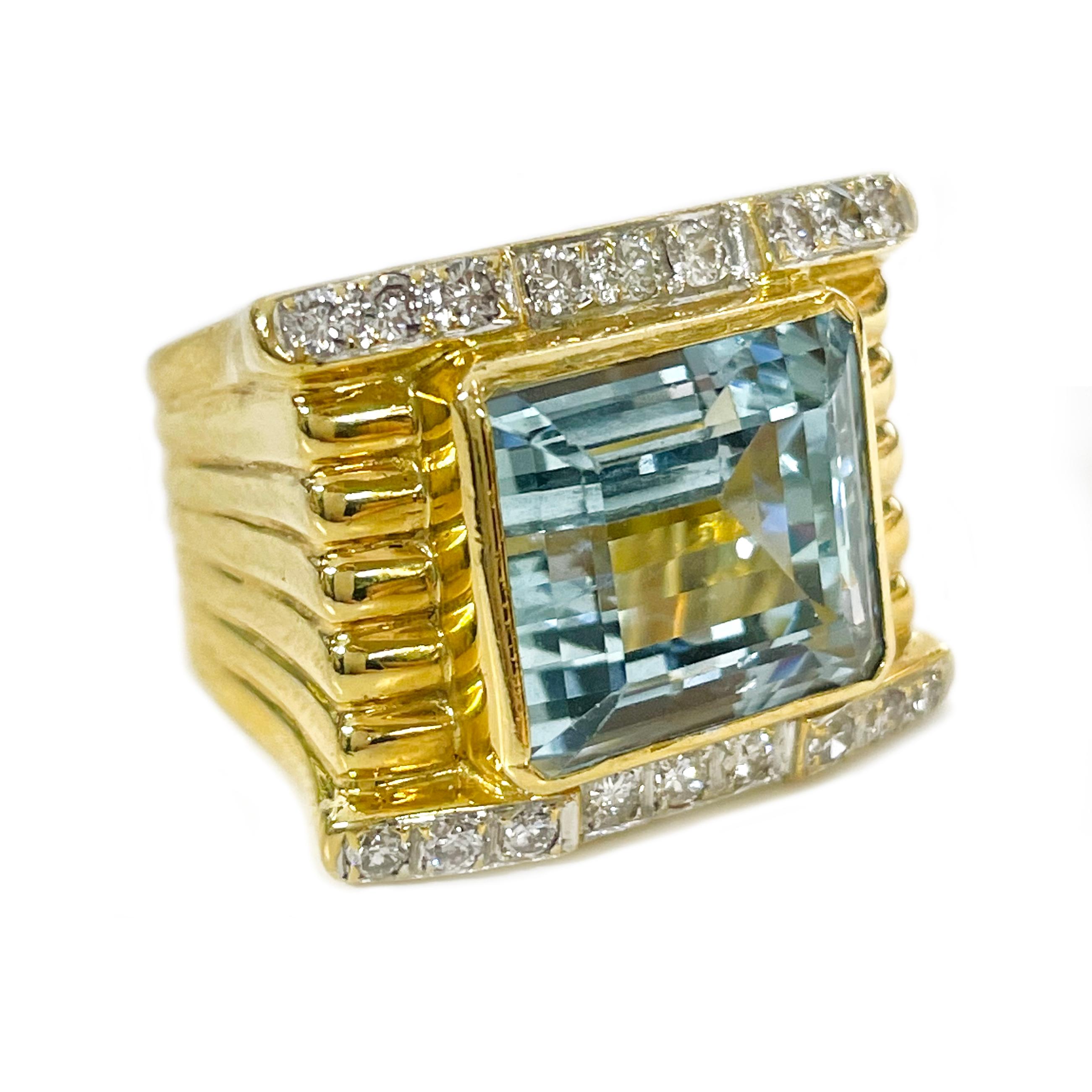 18 Karat Yellow Gold wide band Step-Cut Aquamarine, 19.4 Carat. The ring features a large step-cut Aquamarine gemstone bezel-set in the center of a wide ridged band. One row of round diamonds is bead-set in white gold on the top and another row at