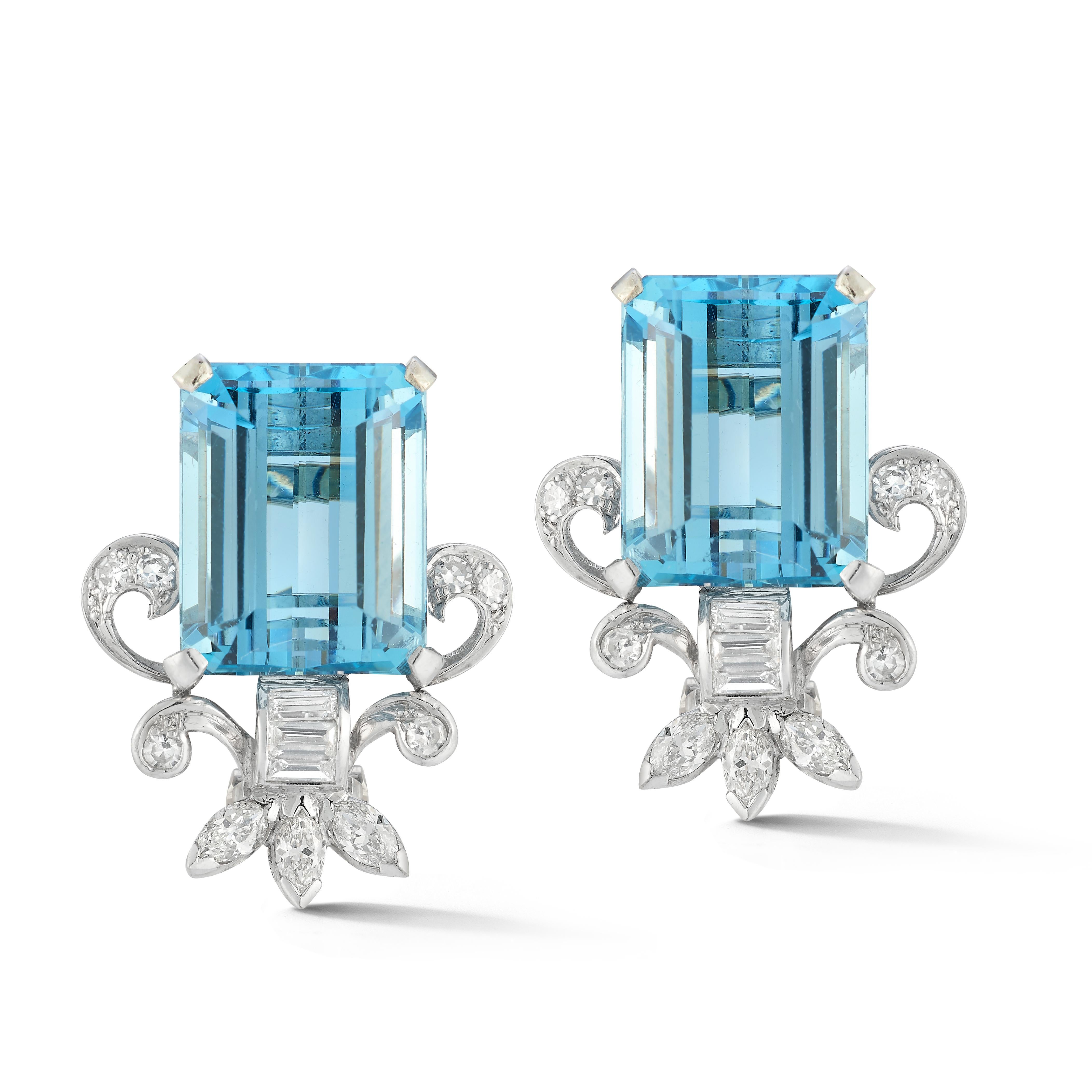 Aquamarine & Diamond Earrings

A pair of platinum earrings set with 2 emerald cut aquamarines and accented with marquise, baguette and round cut diamonds.

Aquamarine Weight: approximately 18.52 carats 
Diamond Weight: approximately 1.29