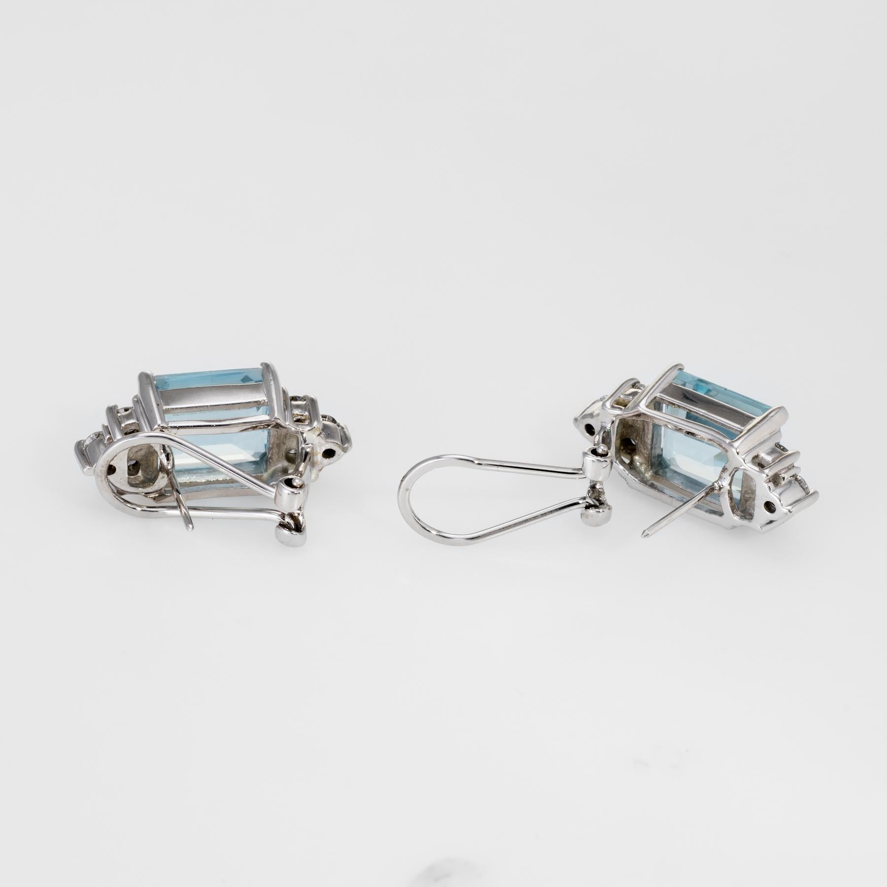 Elegant pair of aquamarine & diamond earrings, crafted in 14k white gold. 

Emerald cut aquamarines each measure 10mm x 8mm (estimated at 3.25 carats each - 6.50 carats total estimated weight), accented with an estimated 0.60 carats of diamonds