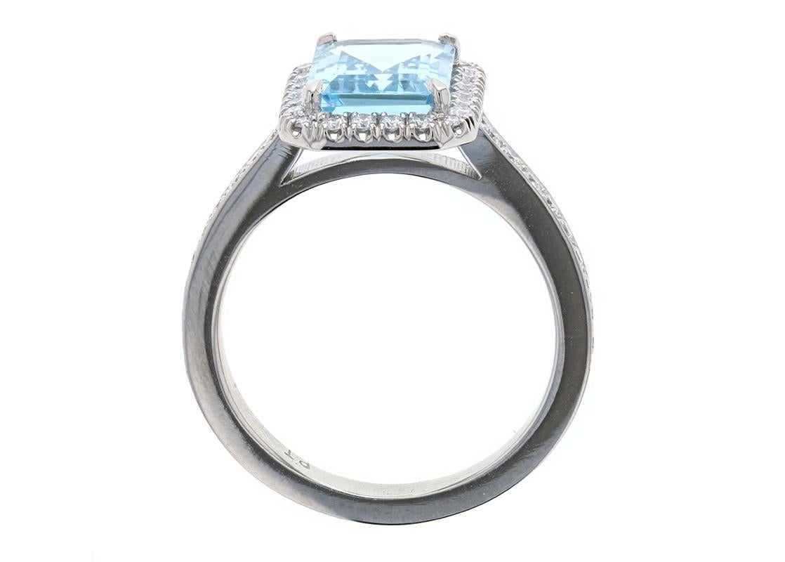aquamarine and diamond halo engagement ring