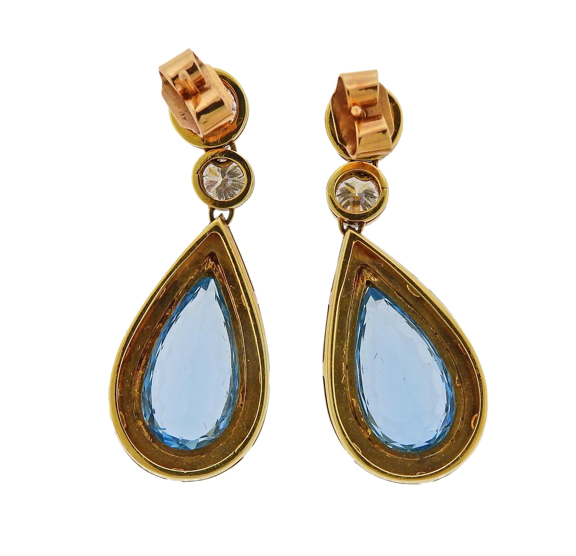 Pair of 18k yellow gold teardrop earrings, set with approx. 2.20ctw in diamonds and teardrop aquamarines. Earrings are 36mm long x 15mm wide. Tested 18k. Weigh 13.5 grams.

SKU#E-01789