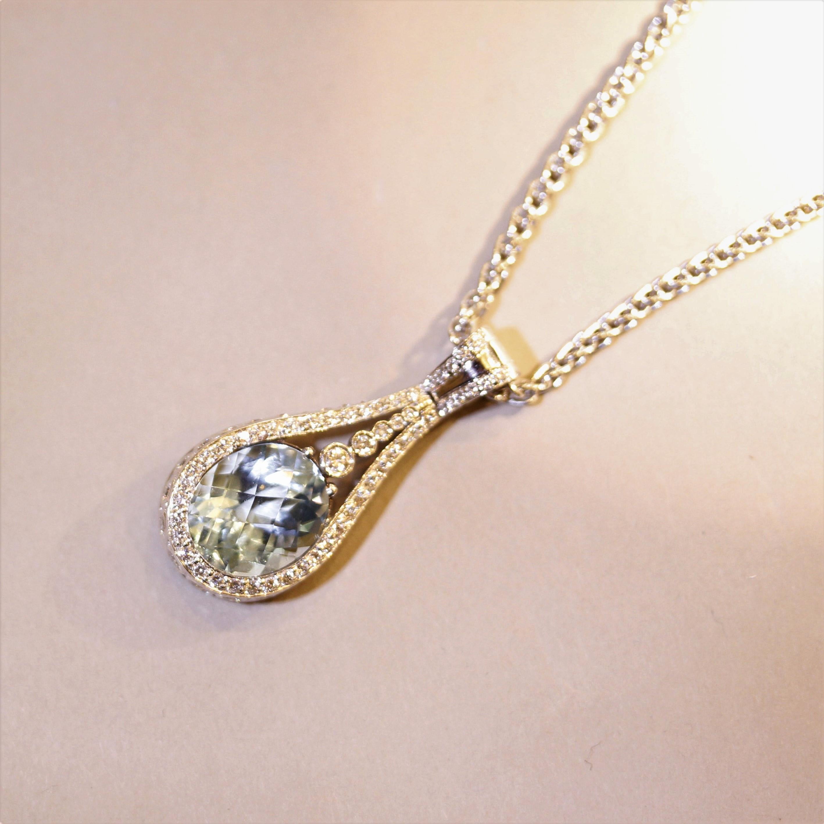 A sleek and sexy pendant featuring a 7.40 carat aquamarine with a unique rose-cut. It has a classic sea-blue color and is accented by 1.06 carats of fine round brilliant cut diamonds which are set across the pendant in a stylish pattern. Made in 18k