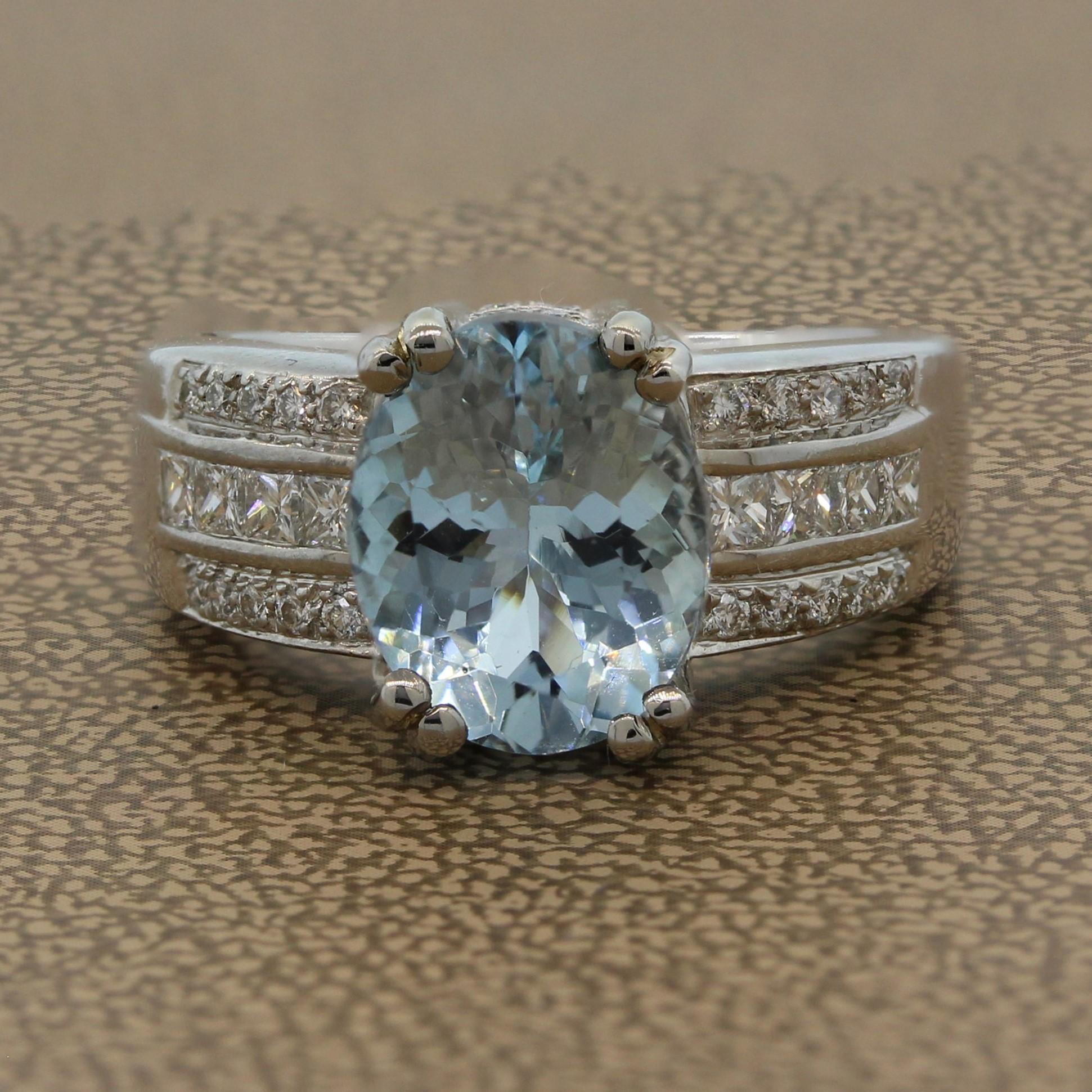 A contemporary ring featuring a 3.25 carat aquamarine with a lovely soft blue hue. The oval cut aquamarine is set in 14K white gold and is surrounded by 0.80 carats of VS quality colorless princess cut diamonds and round cut diamonds. A gem set ring