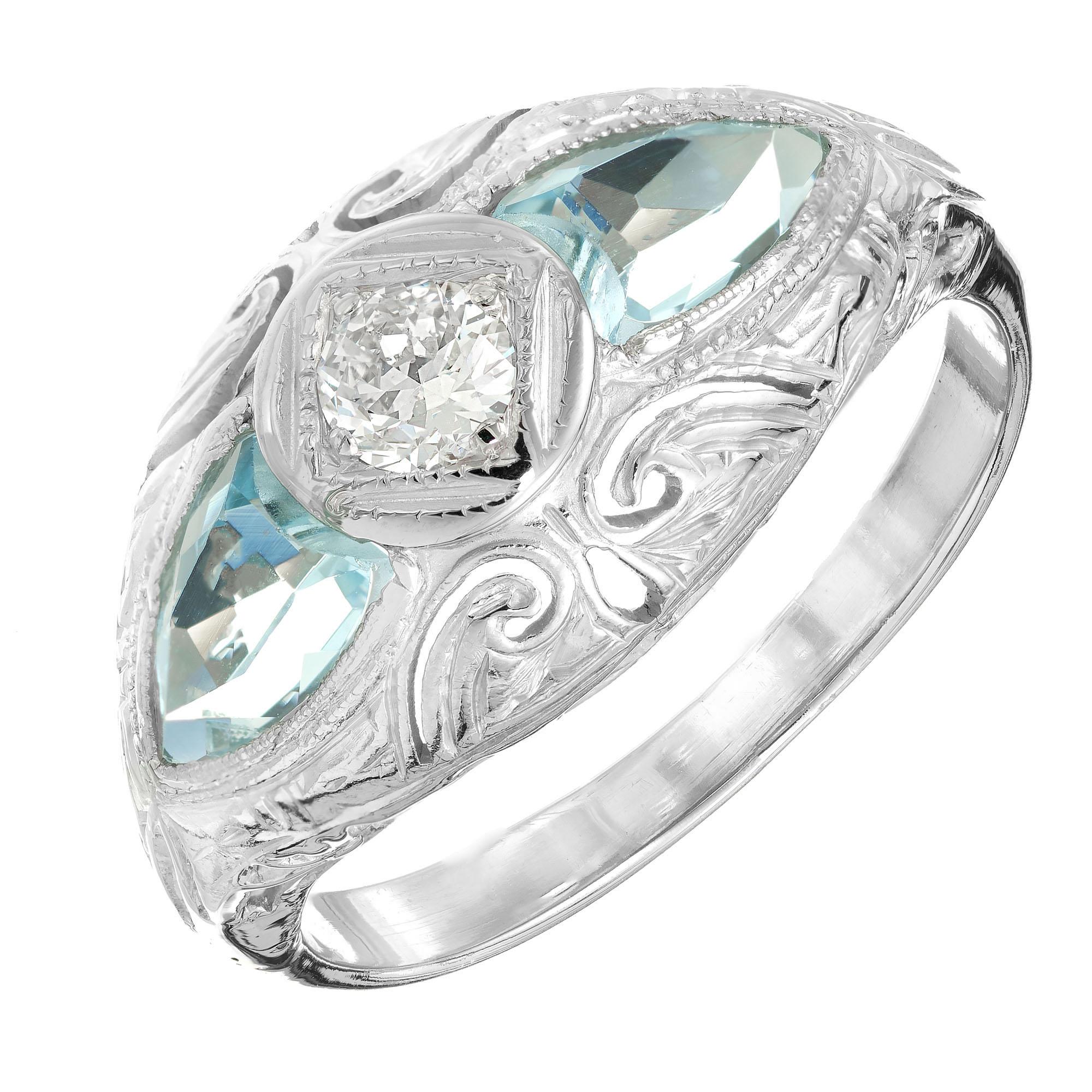 1920's Art Deco diamond and aqua engagement ring. .10ct European cut center stone with 2 shield cut aquamarines in a 14k white gold setting. 

1 European cut diamond, approx. total weight .10ct, G, VS
2 shield cut genuine untreated Aqua 6 x 4mm,