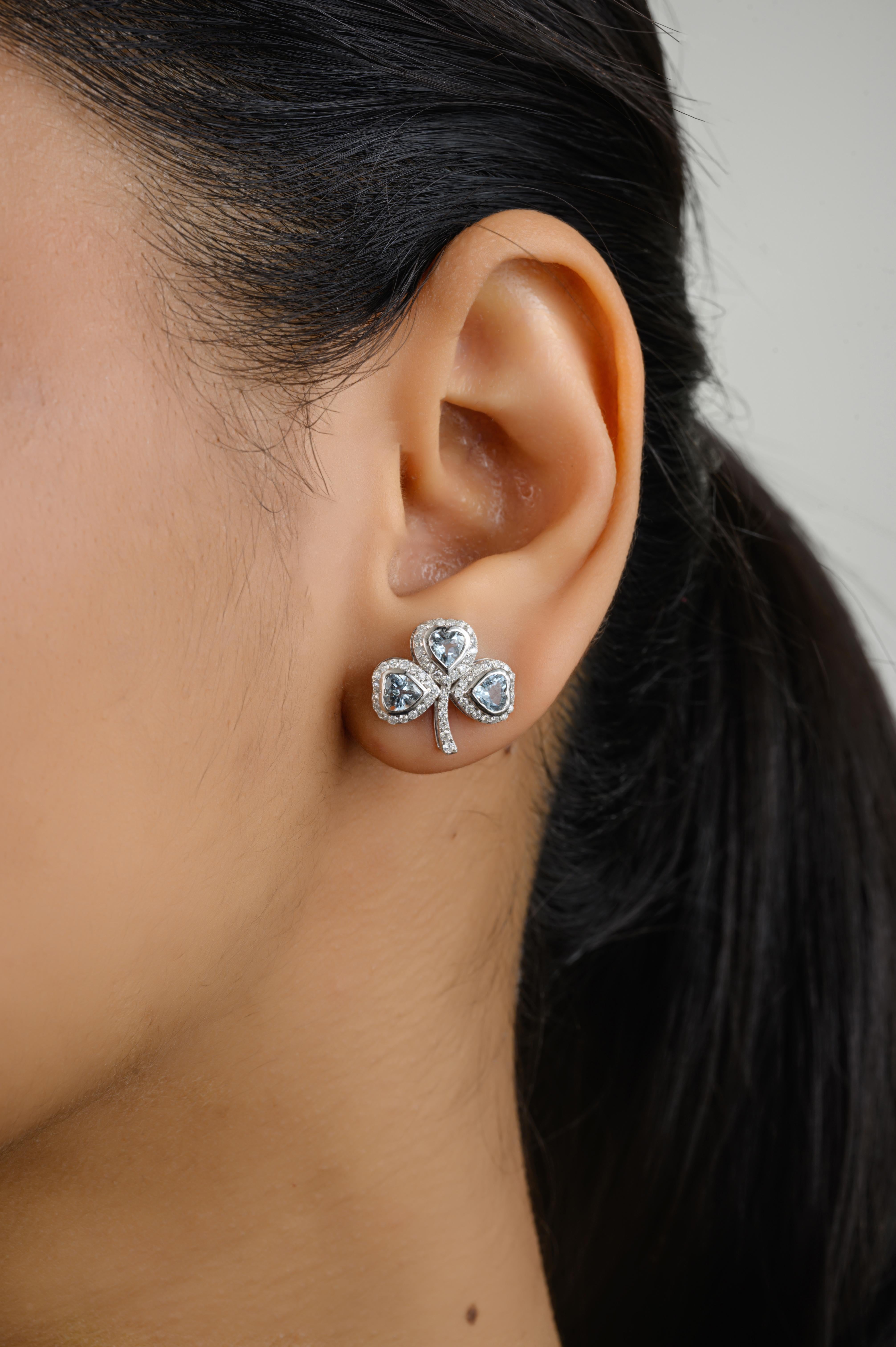 Aquamarine Diamond Halo Clover Wedding Stud Earrings for Women in 18K Gold to make a statement with your look. You shall need studs earrings to make a statement with your look. These earrings create a sparkling, luxurious look featuring heart cut