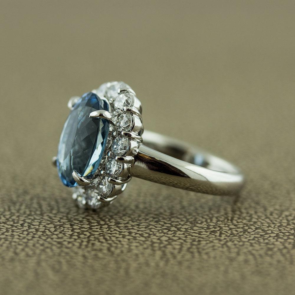 Aquamarine Diamond Halo Platinum Ring


As good as it gets! This luscious sea blue aquamarine has the perfect hue and saturation for aquamarine. It weights 4.59 carats and is cut as a classic oval shape. Surrounding the gem are 1.52 carats of round