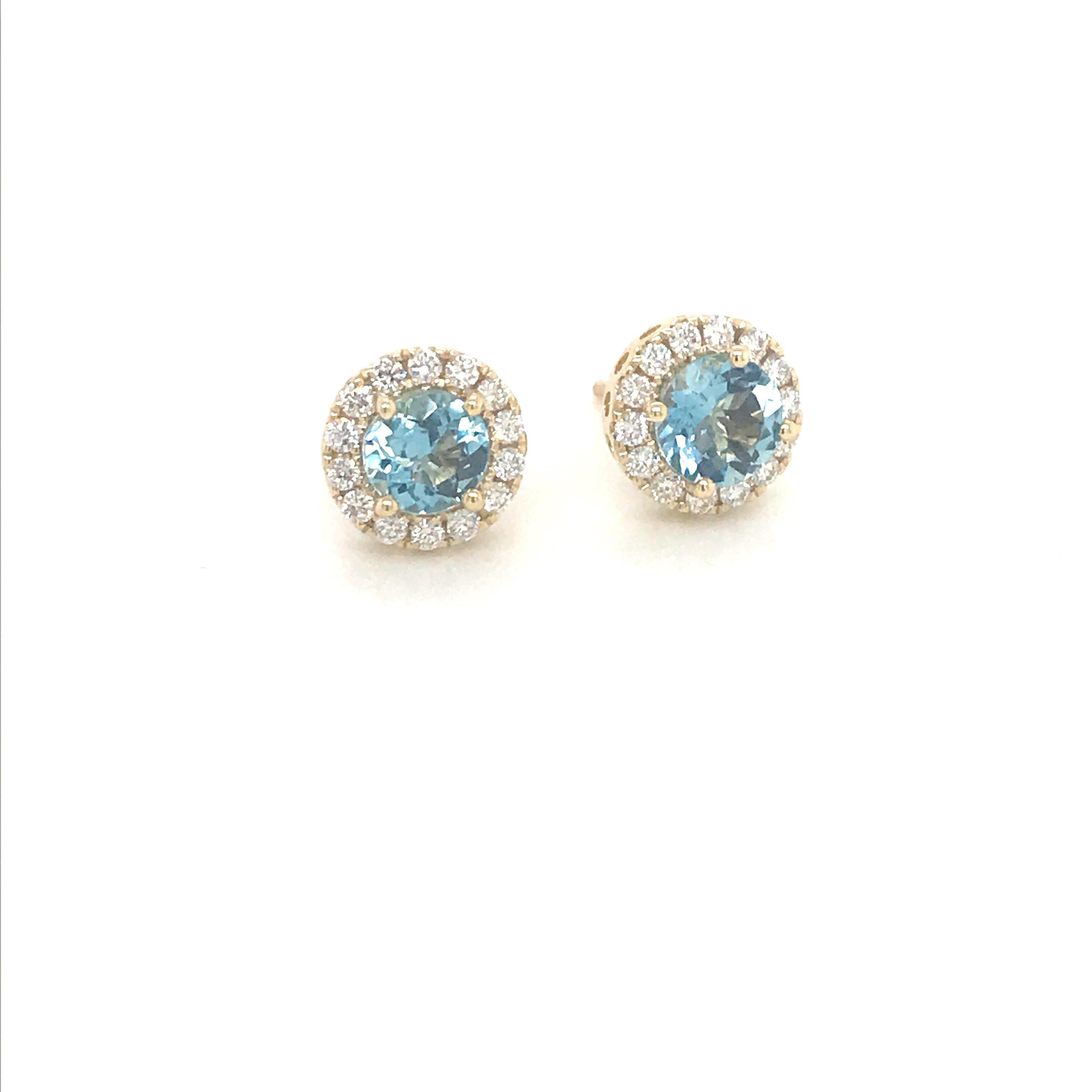 14K Yellow gold earrings featuring one aquamarine weighing 1.33 carats flanked with a diamond halo weighing 0.40 carats.
Color G
Clarity VS-SI

Available in white gold. 
