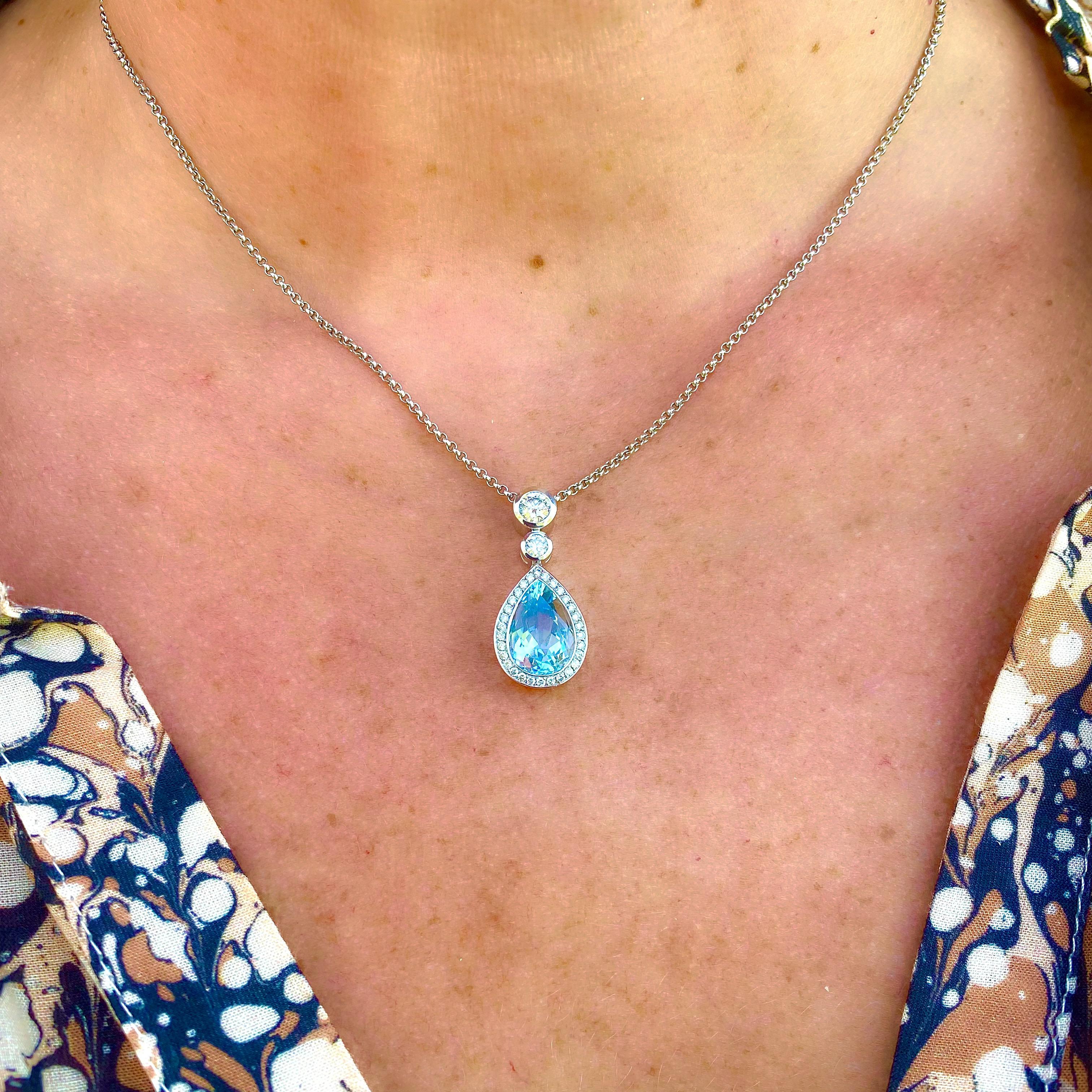 Elegant and classic, this 18k white gold necklace is a great addition to one's collection! The pendant features a pear-shaped aquamarine weighing 3.62 carats, framed and surmounted with round brilliant-cut diamonds, weighing in total 0.64-ct., and