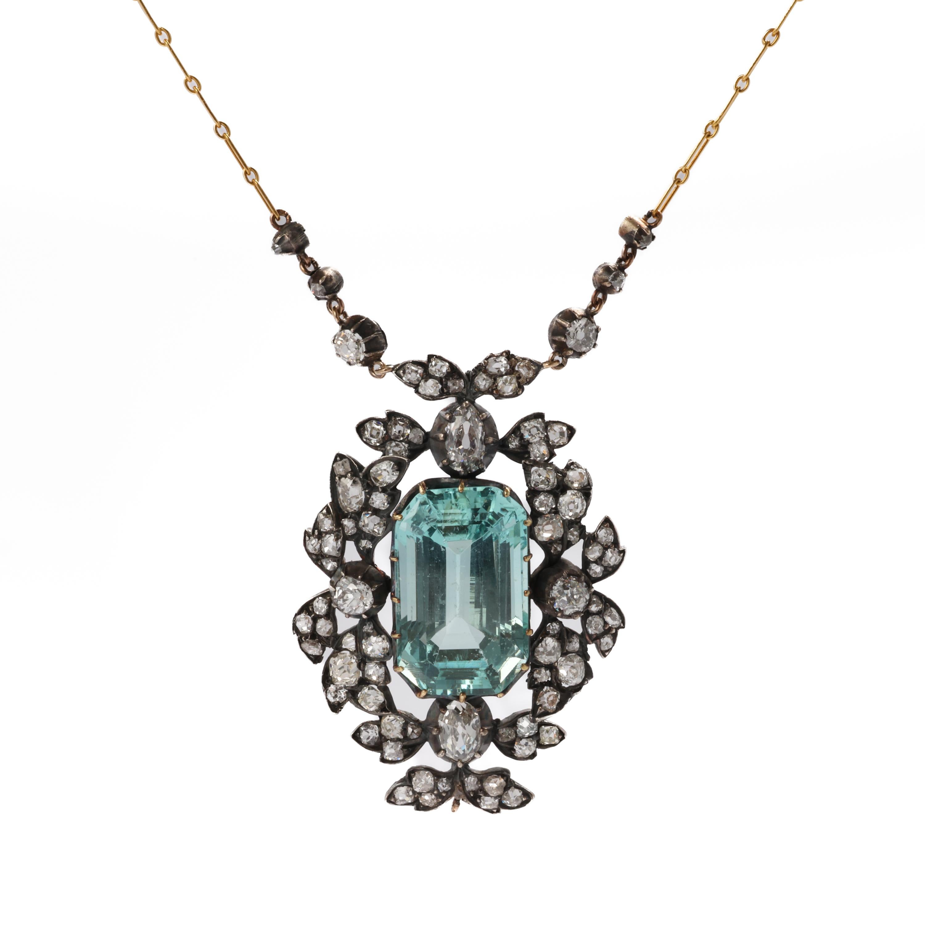 This ravishing antique aquamarine necklace dates to the Regency period (1811-1820). This crowning jewel from the era features an exquisite and huge emerald-cut aquamarine of the most sublime light blue. This glorious gem is set within a foliate