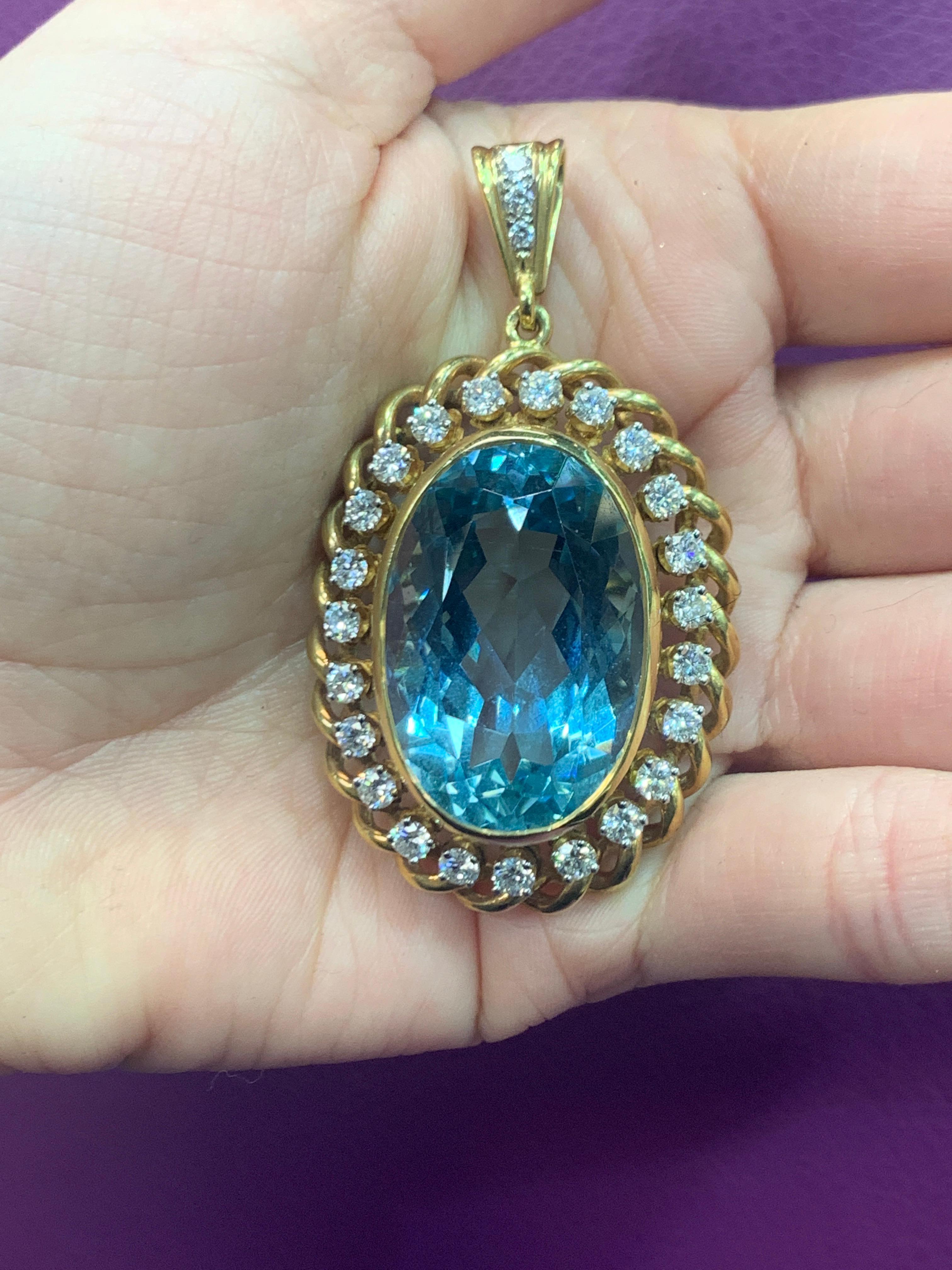 Huge Aquamarine & Diamond Pendant , 1 oval cut aquamarine surrounded by 26 round cut diamonds .
Aquamarine Weight: approximately 38.00 Cts  
Diamond Weight: approximately 1.80 Cts  
Measurements: 2.25