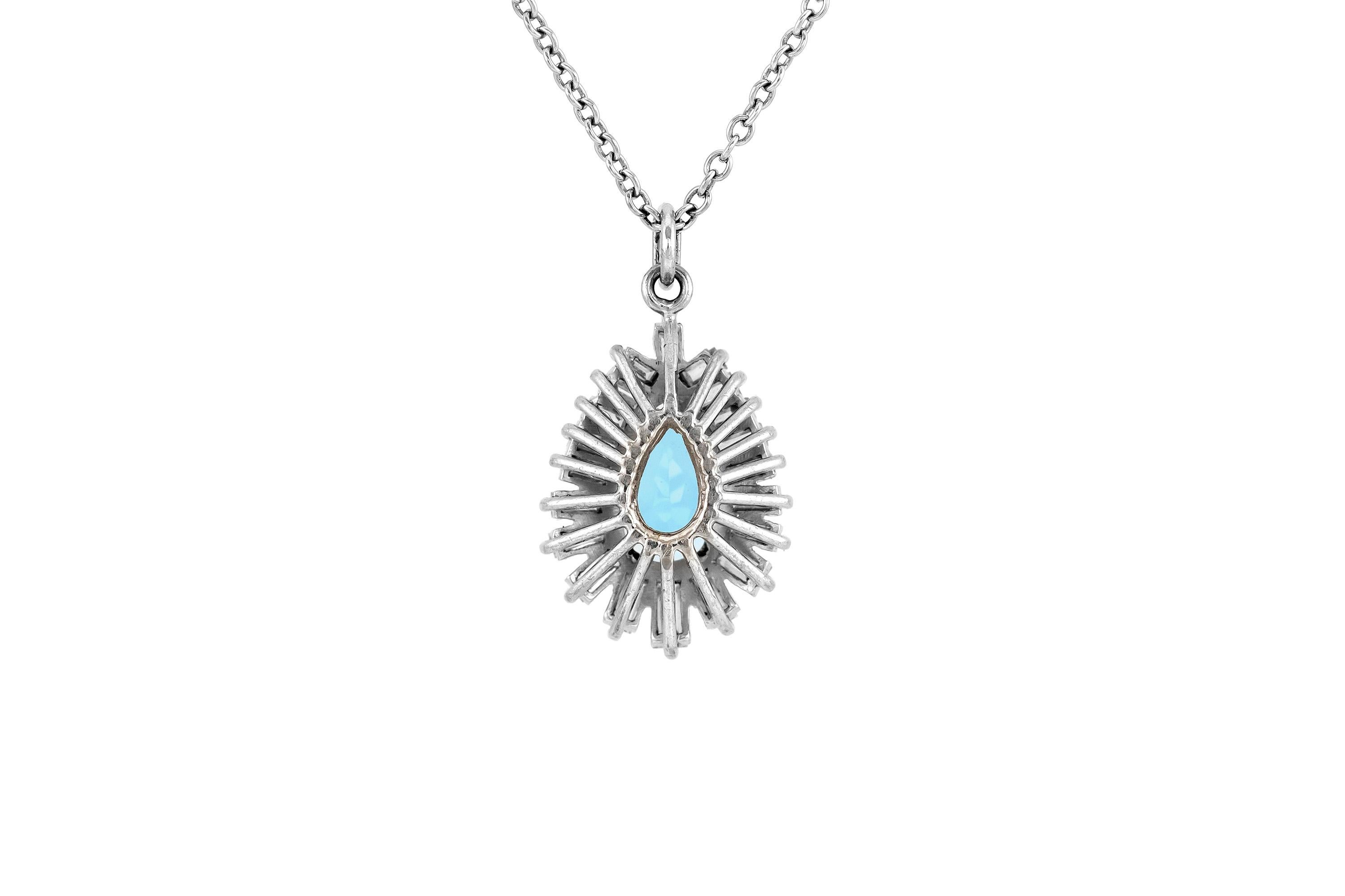 The pendant and necklace are finely crafted in 18k and 14k, with diamonds weighing a total of 1.50 dwt. Circa 1960.