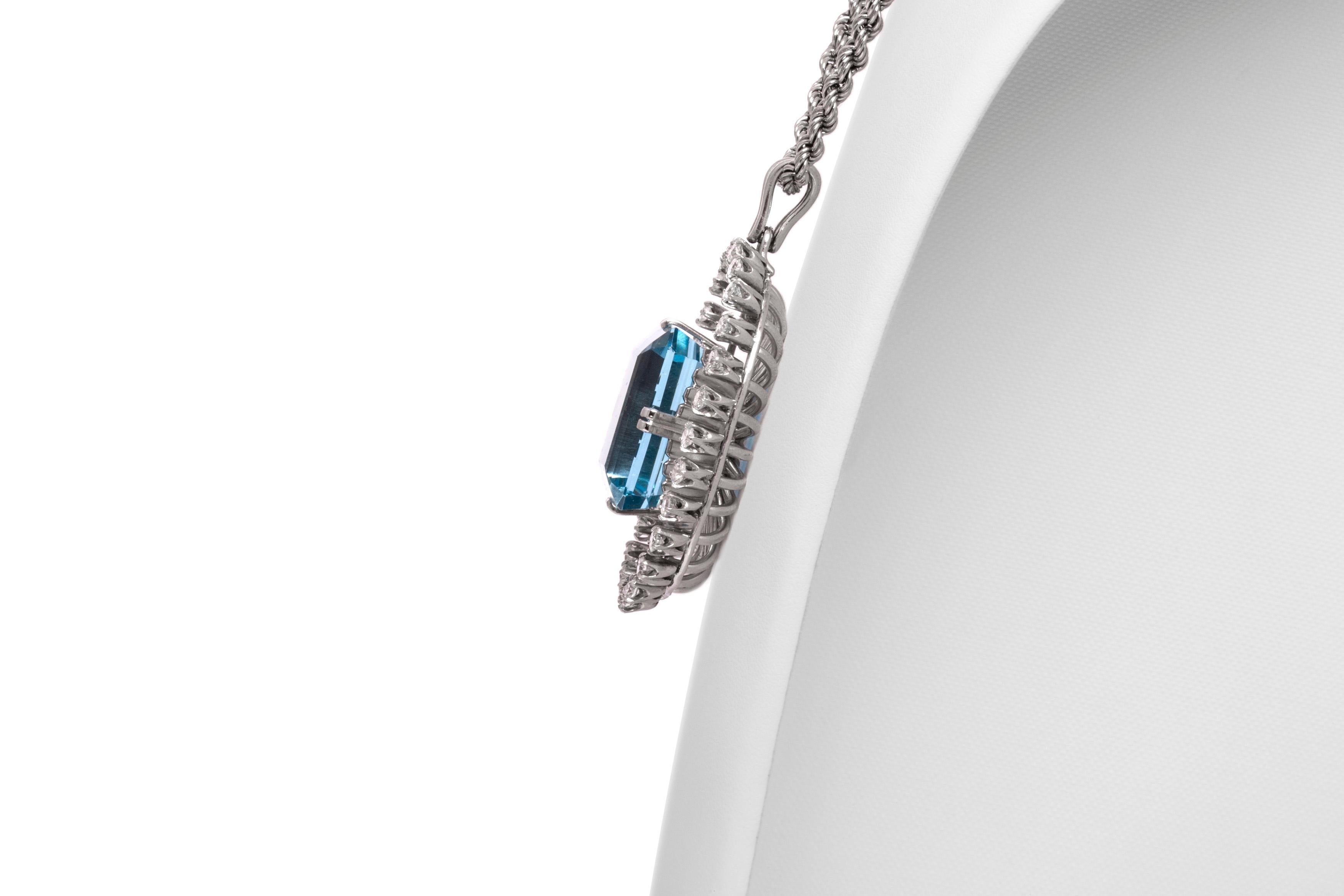 Necklace, finely crafted in platinum with an aquamarine pendant weighing approximately a total of 40.00 carats and diamonds around weighing approximately a total of 2.00 carats. Circa 1940's.