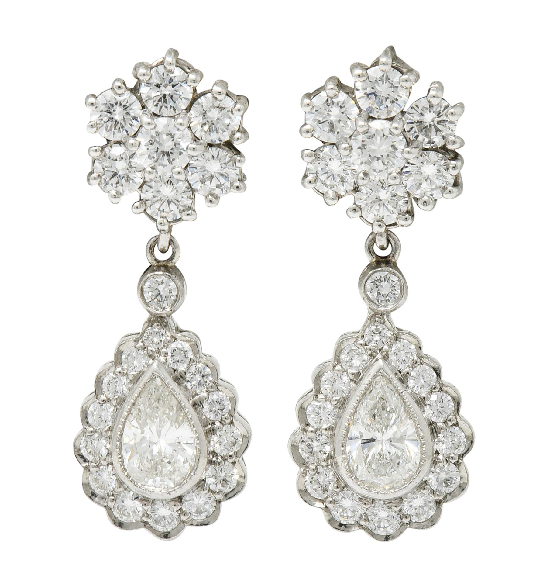 Earrings are designed as clustered diamond stud surmounts with two optional drops

Drops center either a pear cut diamond or a pear cut aquamarine; both surrounded by diamonds

Aquamarine weigh in total approximately 1.05 carats with a 0.95 carat of