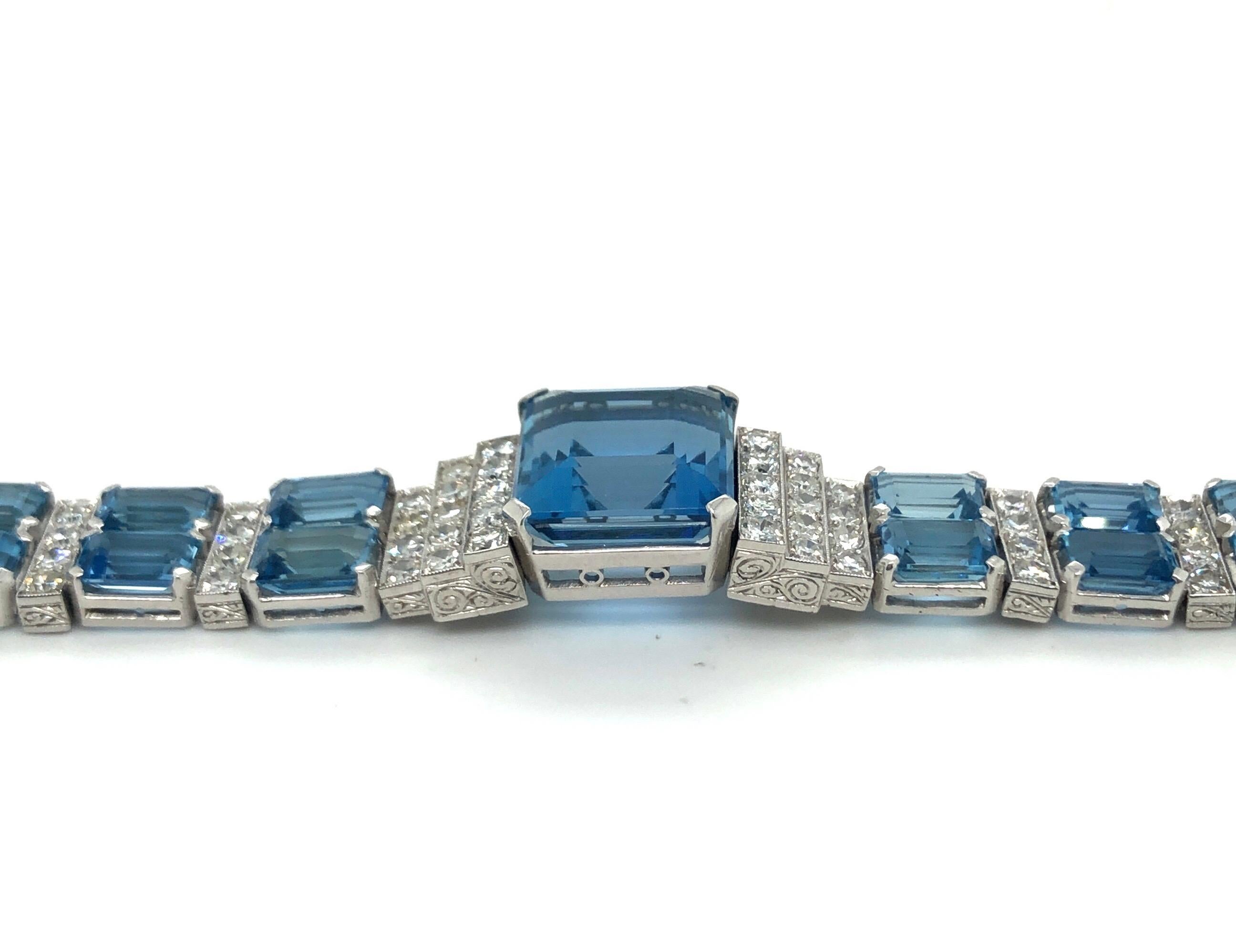 Absolutely stunning Aquamarine Diamond Platinum Art Deco Bracelet from the 1920s.
Entirely handcrafted in platinum and set with 29 octagonal aquamarines of impeccable quality totalling circa 45 carats and 82 old-cut and single-cut diamonds totalling