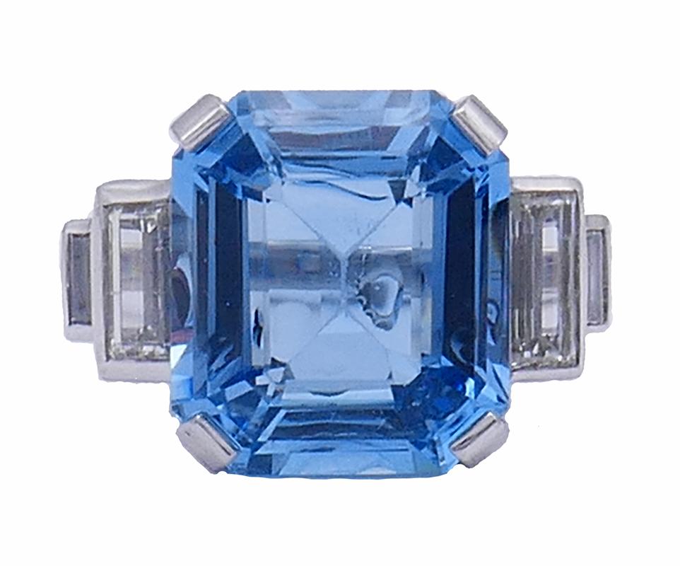 A gorgeous aquamarine diamond platinum ring, designed in Art Deco revival style. 
Four prong platinum setting allows the emerald cut aquamarine to pop and show off its beauty. The aquamarine has a very fine color serving this cocktail ring perfectly