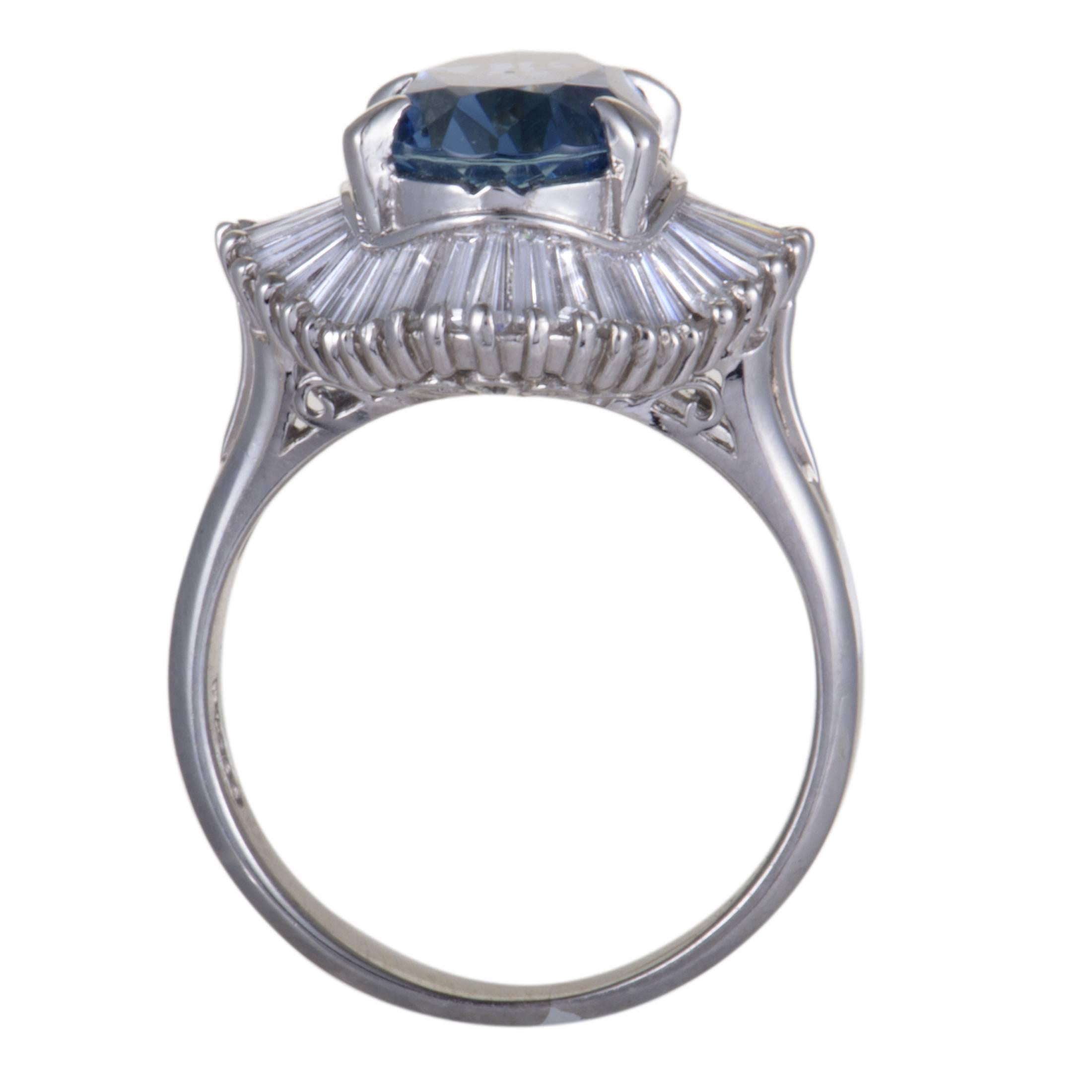 This attractive ring is spectacularly designed in shimmering platinum. The incredible ring features 1.15ct of sparkling diamonds surrounding a mesmerizing aquamarine stone, weighing 3.27ct, in its incredible design that enhance the extravagance of