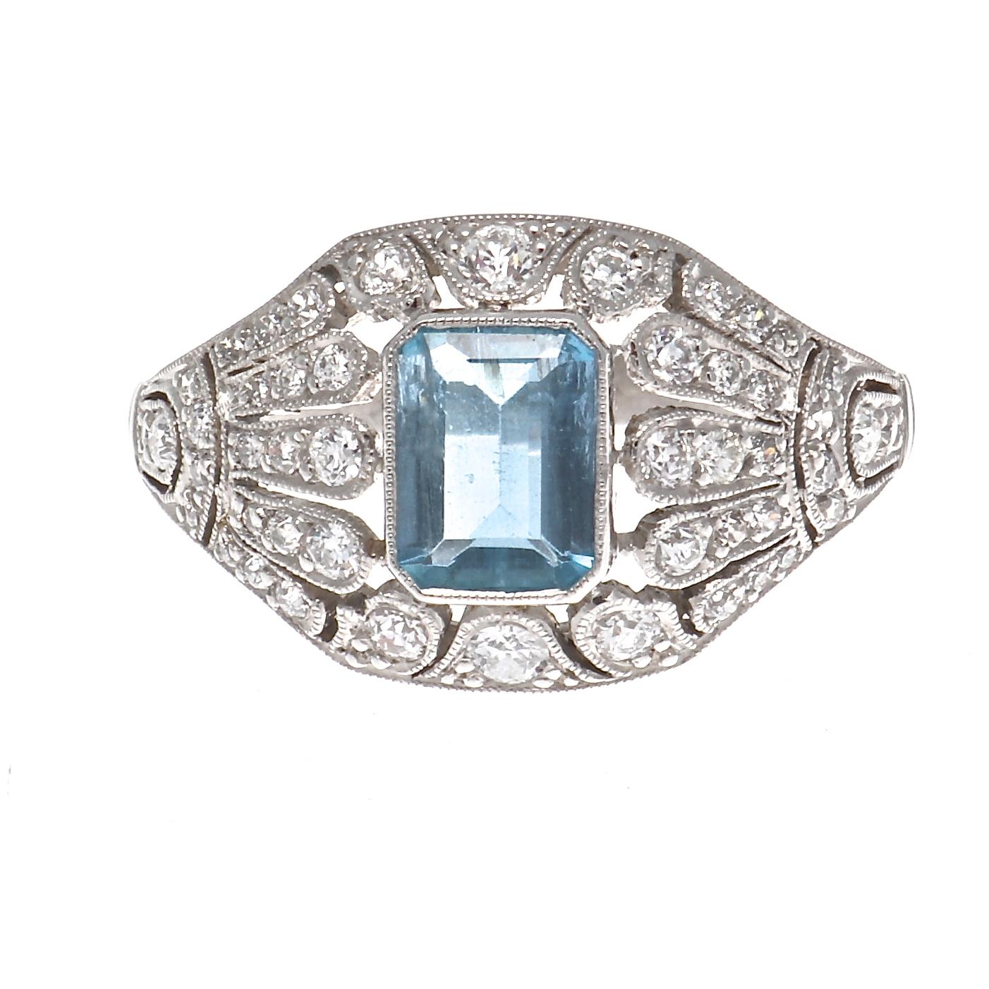 A shade in-between blue and green and one of the most soothing colors on the spectrum. It is believed to have magical powers and is known in ancient folklore as the treasure of mermaids. Featuring a 0.58 carat emerald cut aquamarine that is bezel