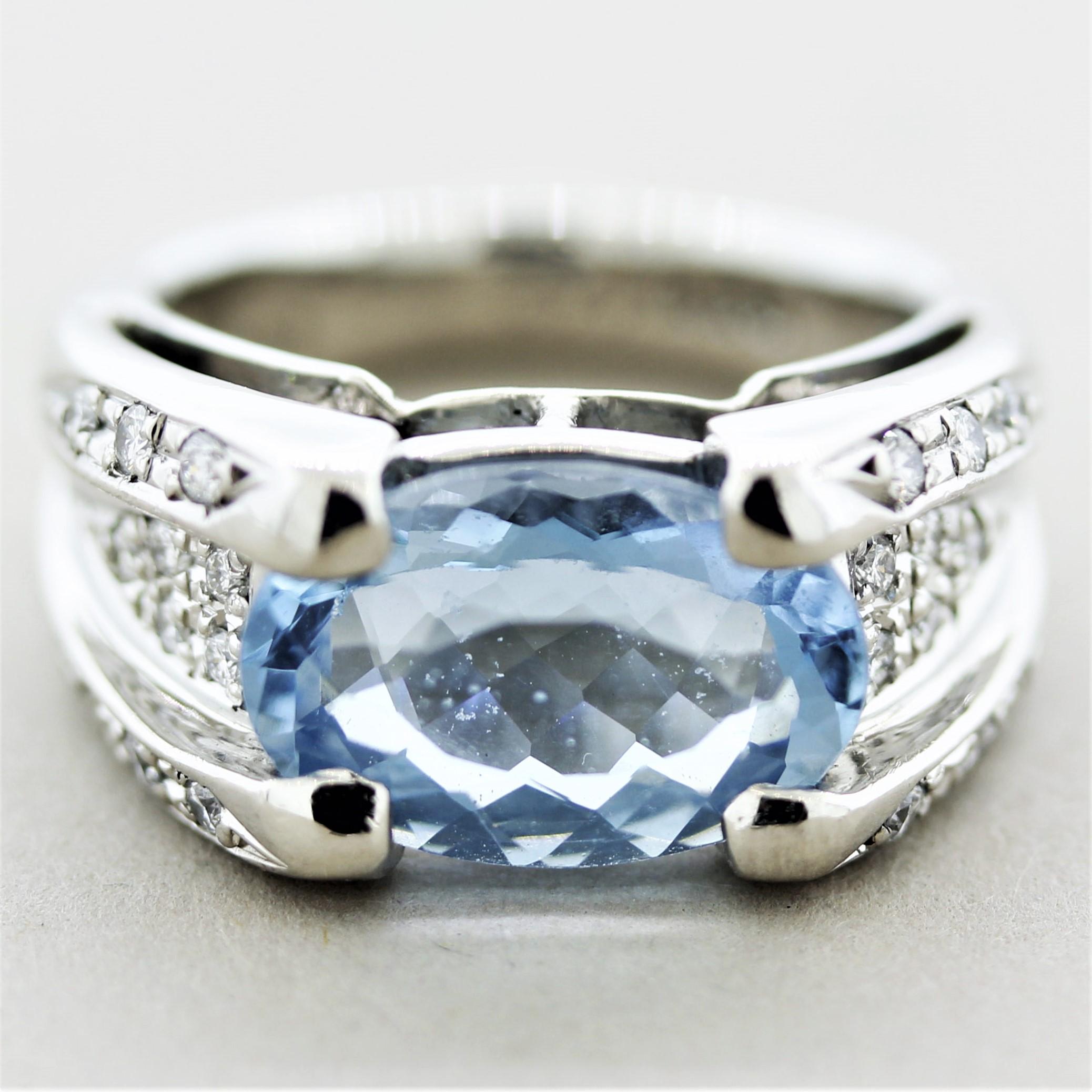 A fabulous ring featuring a 4.42 carat oval-shaped aquamarine! It has a bright sea-blue color with excellent brilliance. It is accented by 0.30 carats of round brilliant-cut diamonds set on the sides of the aqua down the sides of the ring.