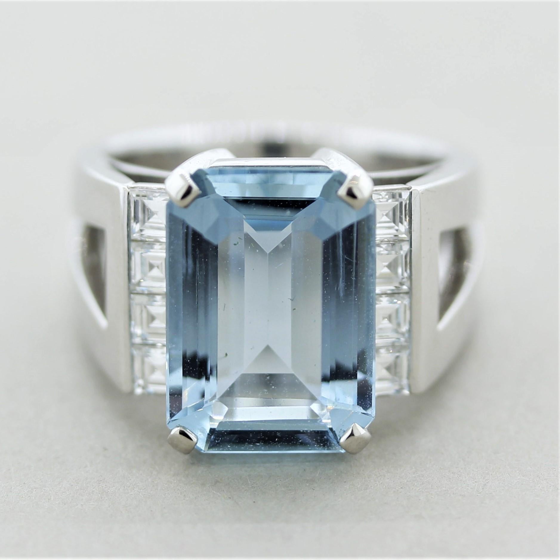 A luscious ring featuring a 5 carat aquamarine gem with a bright and beautiful sea-blue color. It is accented by 8 perfect asscher-cut diamonds which are channel-set on the sides of the aquamarine. Hand-fabricated in platinum, this heavy ring is