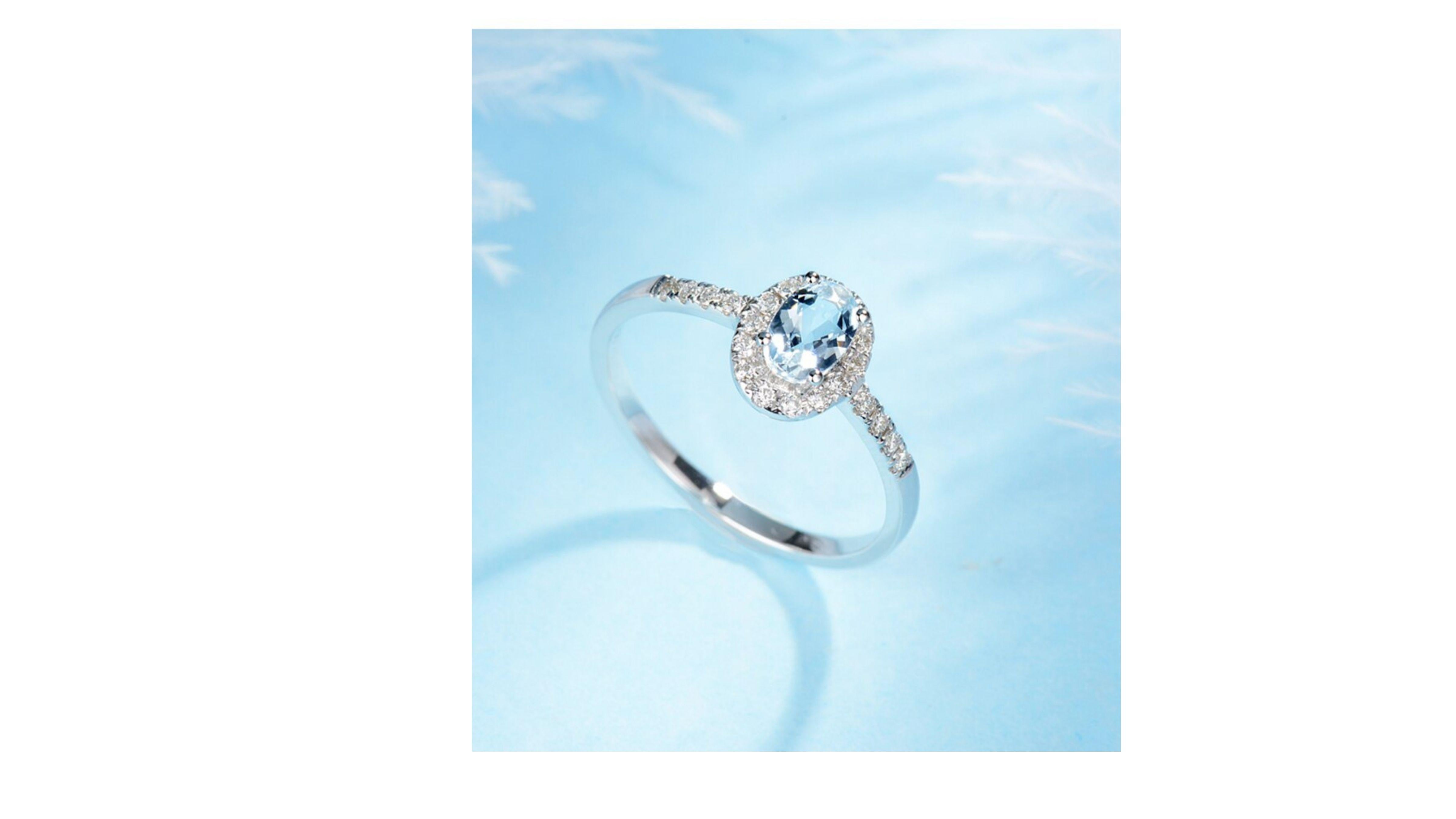 Aquamarine  Ring with diamonds at each side and sparkling like a crystal clear ocean, it was believed to be the treasure of mermaids. Used by sailors as a talisman for protection and courage, the colour Aquamarine is 