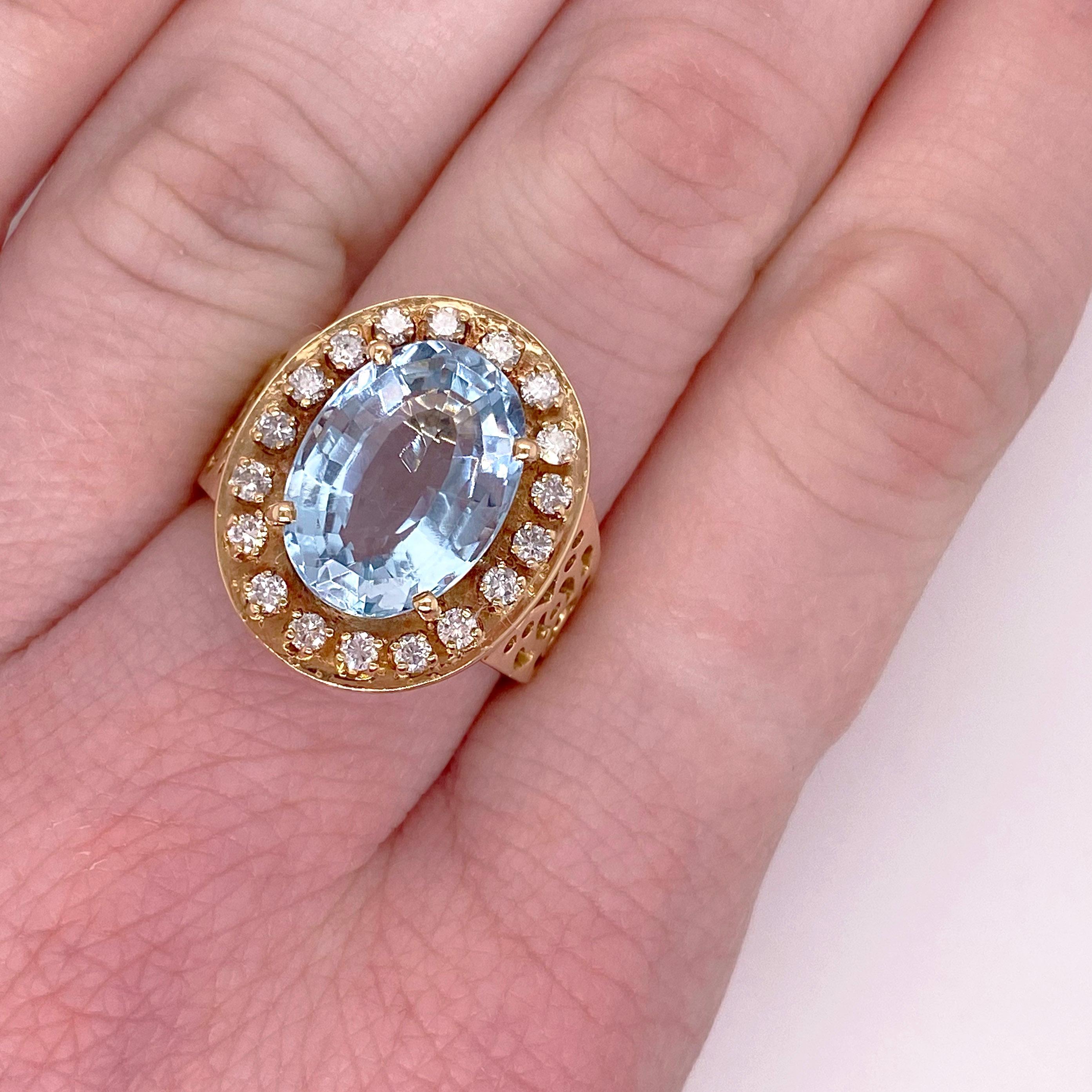 This 5.20 carat genuine and natural aquamarine has a vintage flair.  The filigree design that is cut-out on the sides is very lovely!  The ring has 18 diamonds going around it in a halo design.  You or your loved one will be happy wearing this very