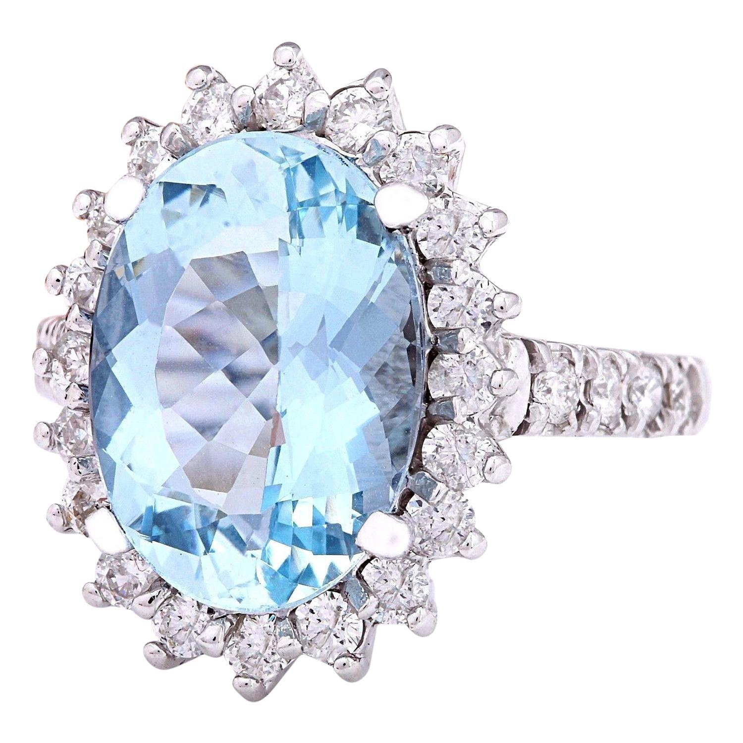 Introducing our exquisite 6.10 Carat Natural Aquamarine 14K Solid White Gold Diamond Ring:
Crafted from lustrous 14K White Gold, this captivating ring features a magnificent 5.10 Carat oval-shaped Aquamarine as its centerpiece, measuring 14.00x10.00