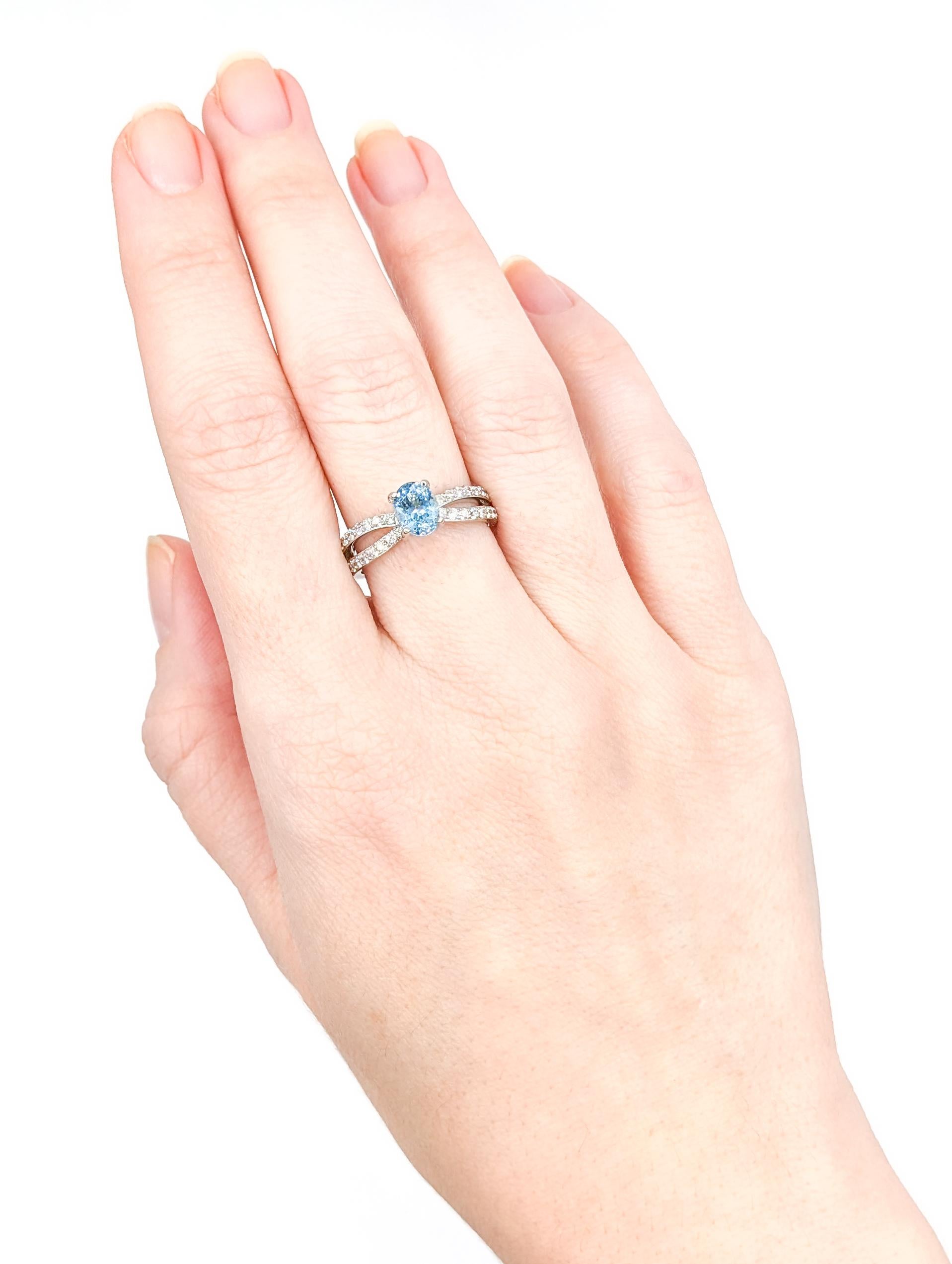 Dreamy Aquamarine & Diamond Ring in 18k White Gold

Elevate your style with this exquisite 18k white gold ring, a true embodiment of beauty and sophistication. This stunning piece showcases a captivating .85ct oval cut Aquamarine complemented by