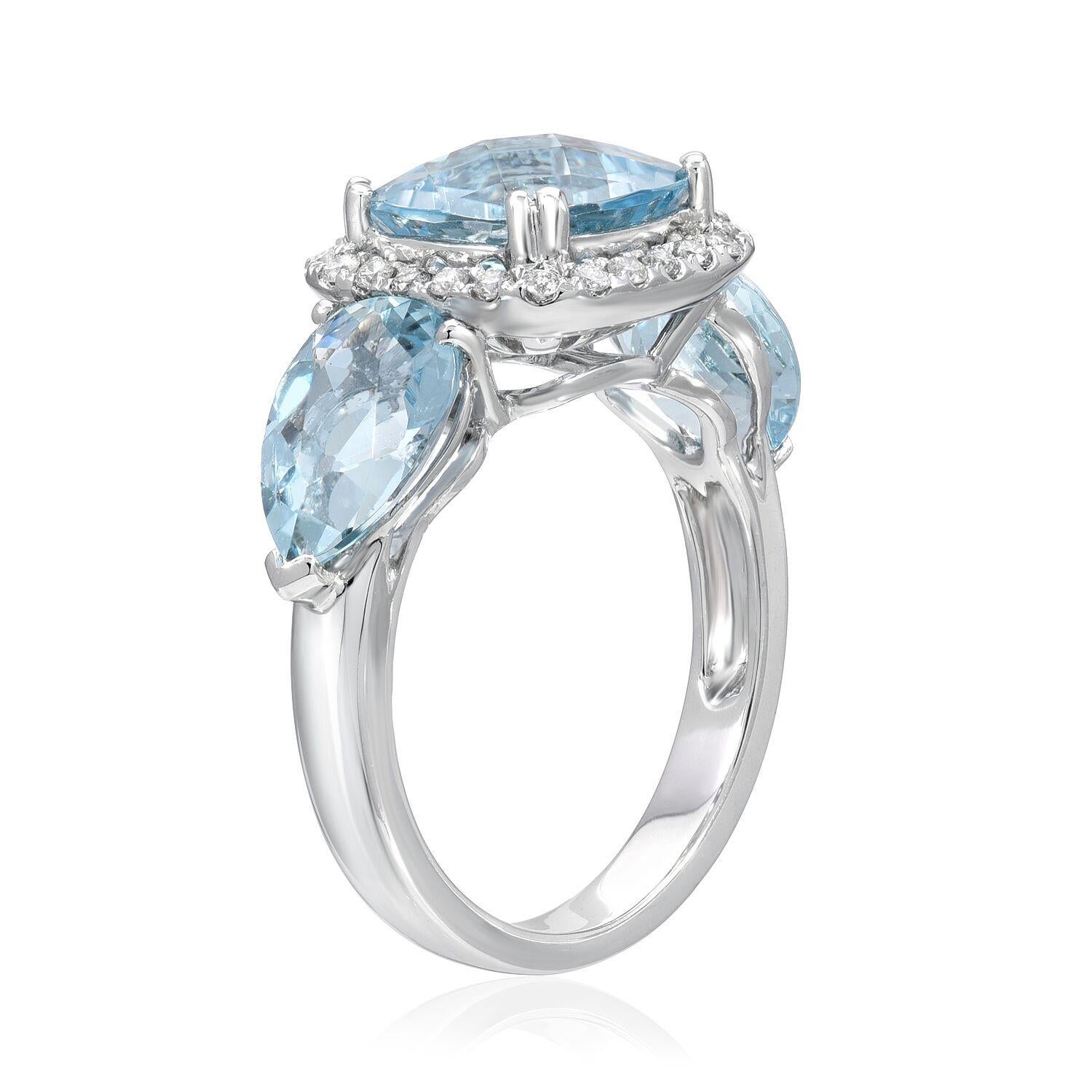 Gorgeous checkerboard cushion cut, and pear shaped Aquamarines weighing a total of 6.25 carats, are set in this 18K white gold three-stone ring, adorned by a total of 0.23 carats of round brilliant diamonds.
Ring size 6.5. Re-sizing is complimentary