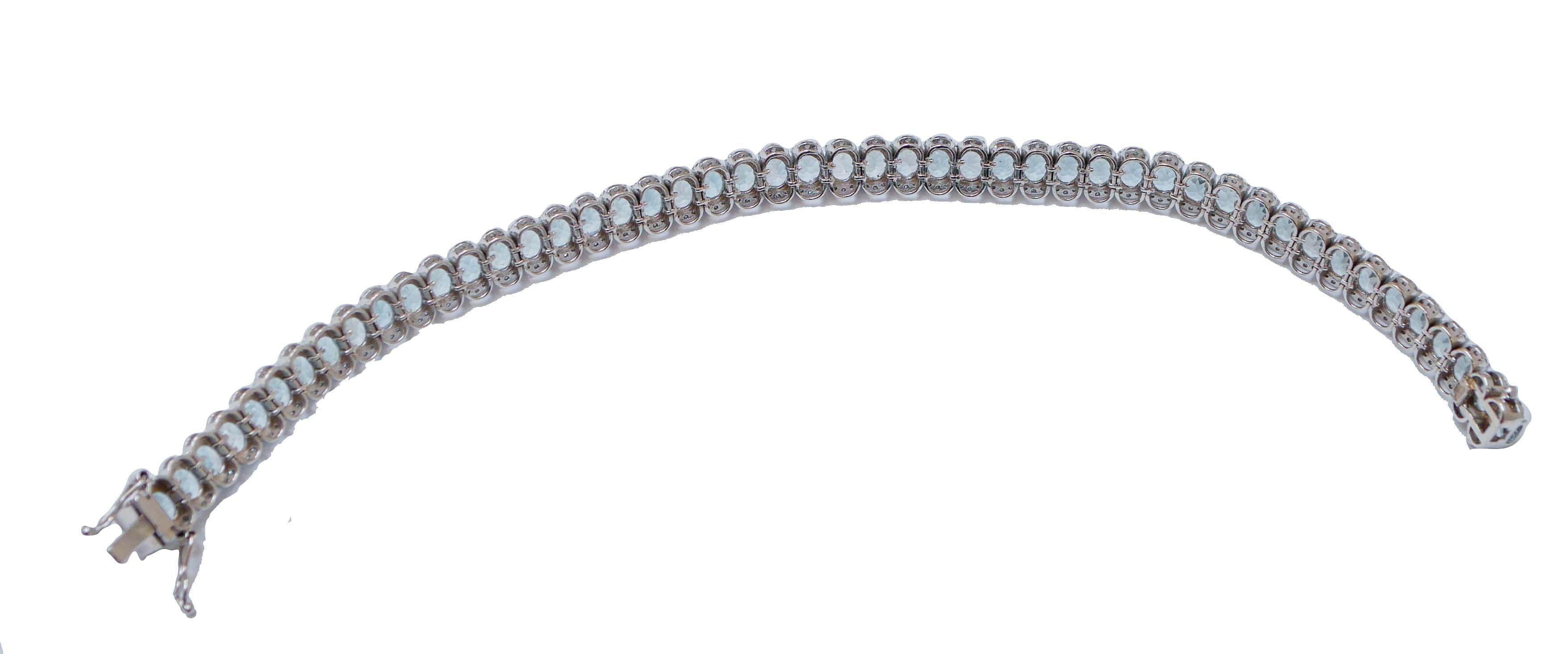 Elegant modern bracelet in 18 kt white gold structure mounted with aquamarine and, for each side, structures studded with diamonds.
Diamonds 1.22 ct
Aquamarine 17.60 ct
Total Weight 18.40 gr
RF   +ECIC

For any informations, feel free to contact the