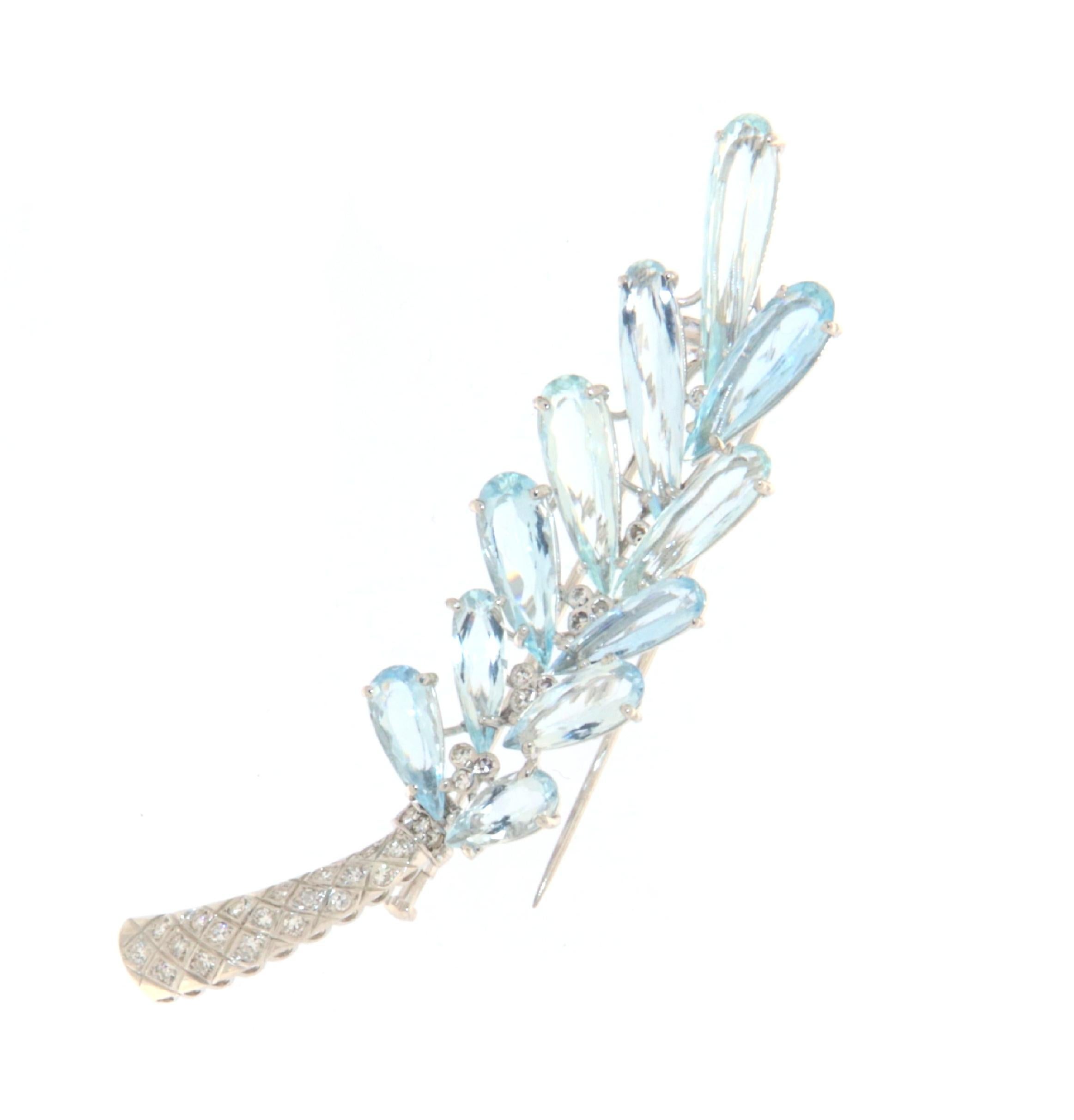This sophisticated brooch is a masterful creation in 18-karat white gold, featuring an exuberant and sparkling design that captures attention. Expertly crafted, the brooch showcases a series of Brazilian drop-cut aquamarines, each set to maximize