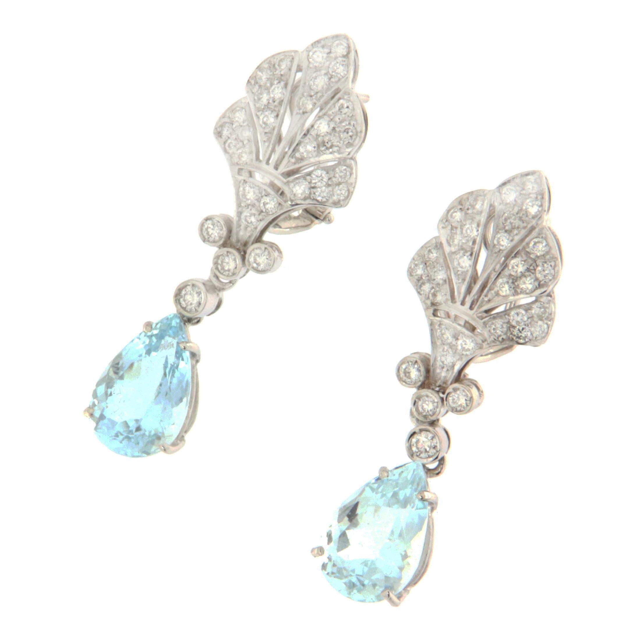 These refined earrings in 18-karat white gold symbolize sophisticated elegance, perfect for brightening any occasion with their splendor. At the heart of these jewels hang majestic Brazilian aquamarine drops, chosen for their crystal-clear blue