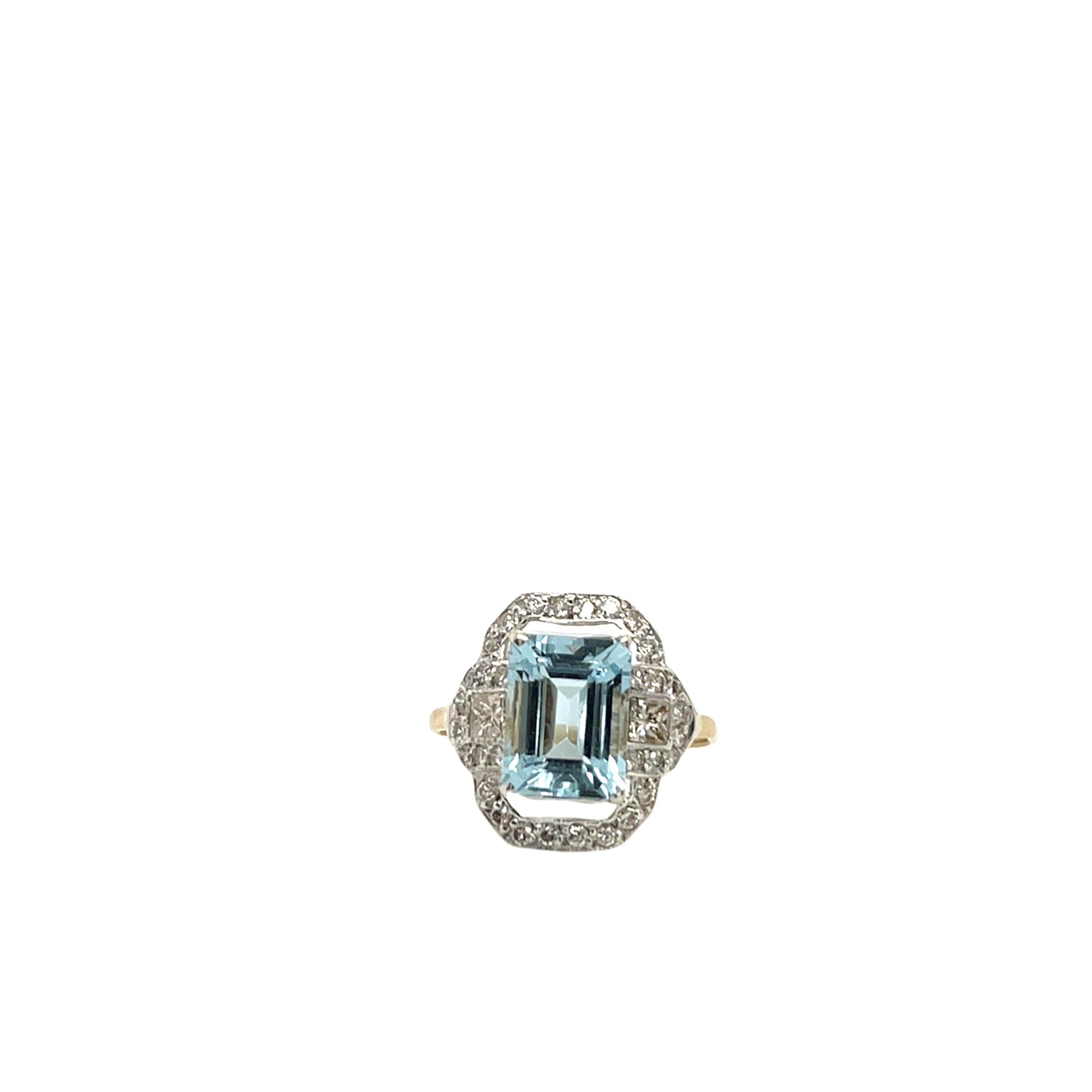 This enchanting ring features a beautiful aquamarine stone complemented by sparkling diamonds, set in a unique blend of 14ct yellow gold band and silver head.  A vintage-inspired piece that combines elegance and charm, perfect for those who