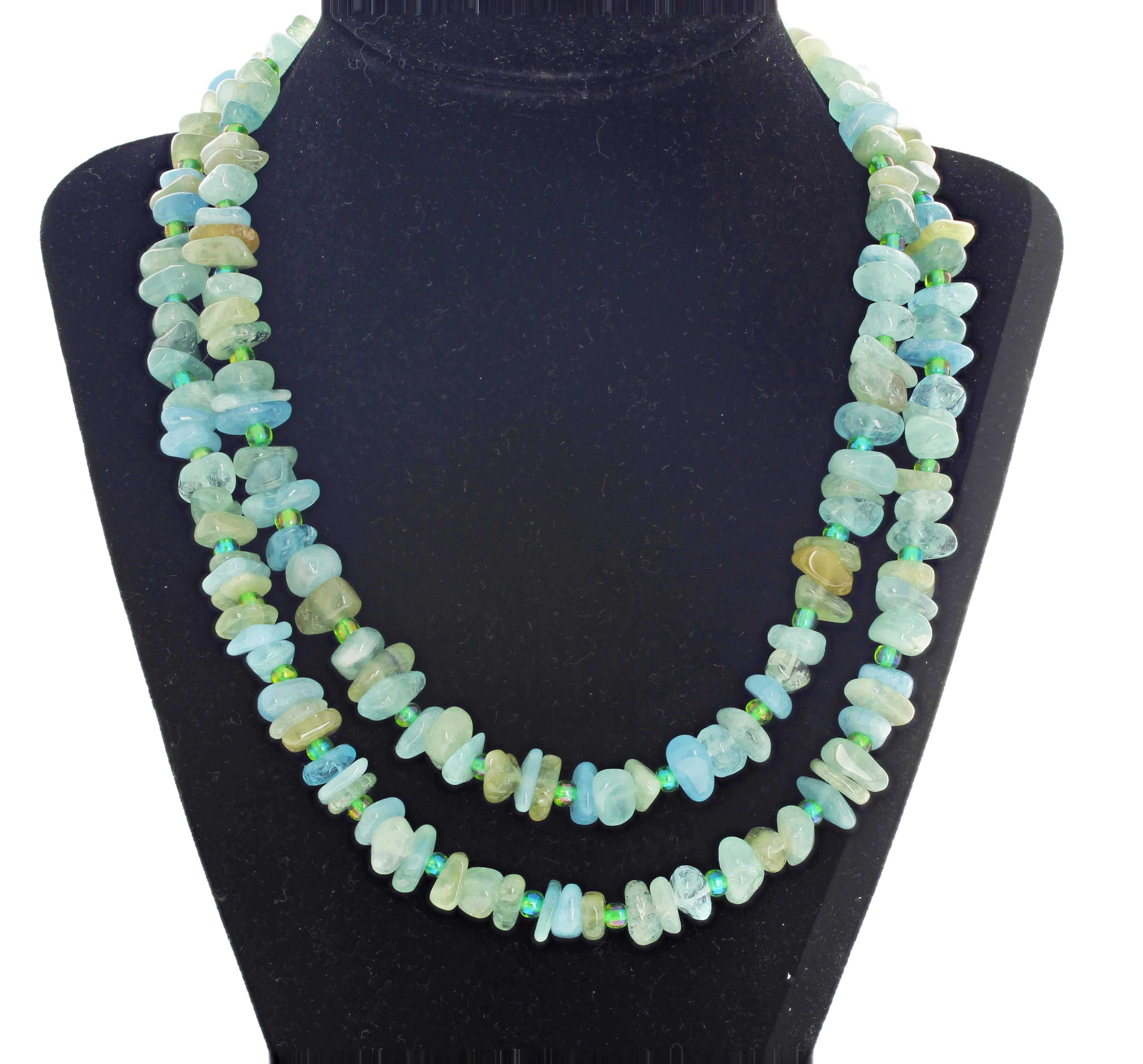 Beautiful glowing double strand of polished natural multi-tone Aquamarine gemstone necklace enhanced with glittering blue-green crystals in a double strand 17.5 inch long necklace with a gold tone clasp.  The Aquamarines are slightly different sizes