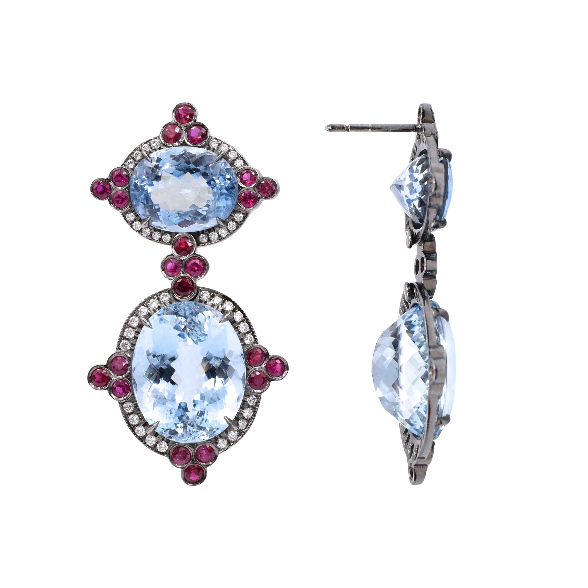 Made in 14 carat white gold, in a black rhodium. Consisting of:, 4 oval aquamarines, total weight approximately 35.00 ct; 44 round rubies, total weight approximately 6.00 ct; 40 round brilliant cut diamonds, approximately 1.25 ct. Weight: 18.10