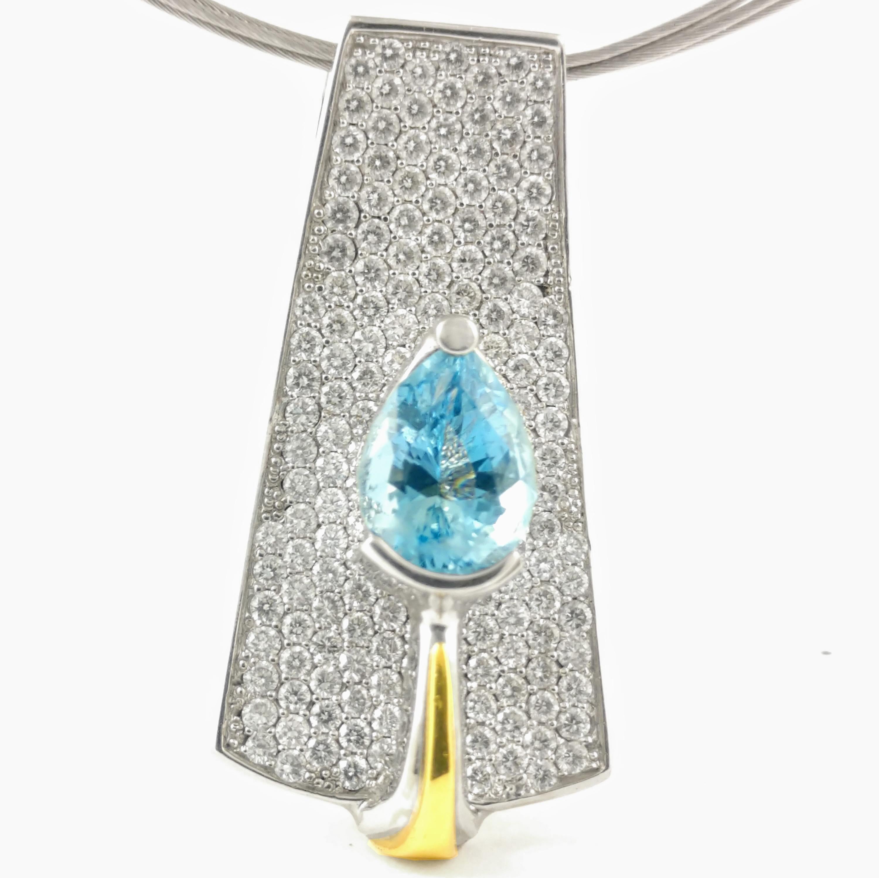 This Cornelis Hollander contemporary necklace features a beautiful pear shape aquamarine. This radiant gemstone weighs 2.49 ct. The pendant is accented with .2.80 ct. of G VS2 diamonds pave set in the 3D plate below the light blue gemstone. The