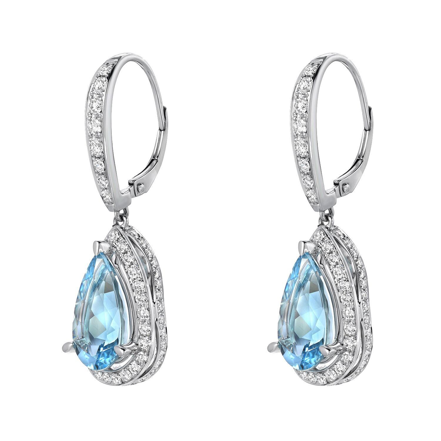 Marvelous pair of 5.23 carats total Aquamarine pear shapes, set in diamond earrings weighing a total of 1.40 carats. These drop, lever back earrings for women, are crafted in 18K white gold,
Total length is approximately 1.25 inches.
Returns are