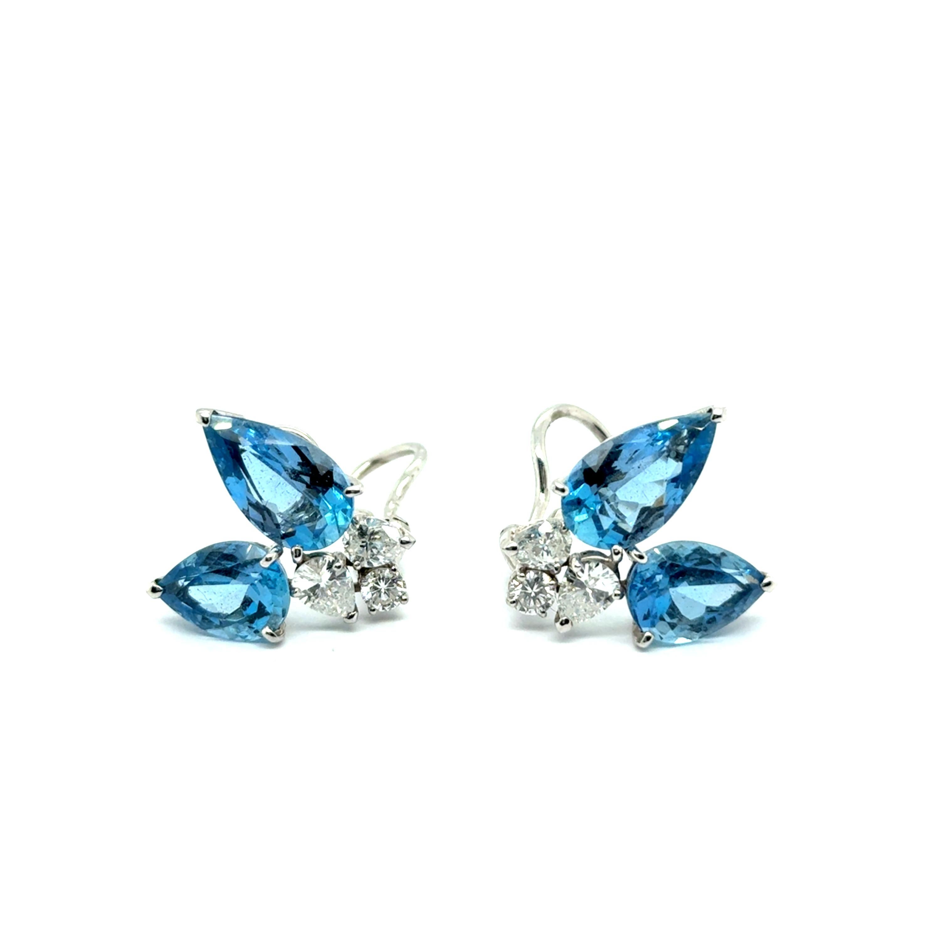 Immerse yourself in timeless sophistication with Peclàrd earrings, crafted in 18 Karat white gold. Highlighting four breathtaking aquamarines totaling 10.60 carats, their serene blue hues evoke the beauty of the ocean. Accented by six sparkling