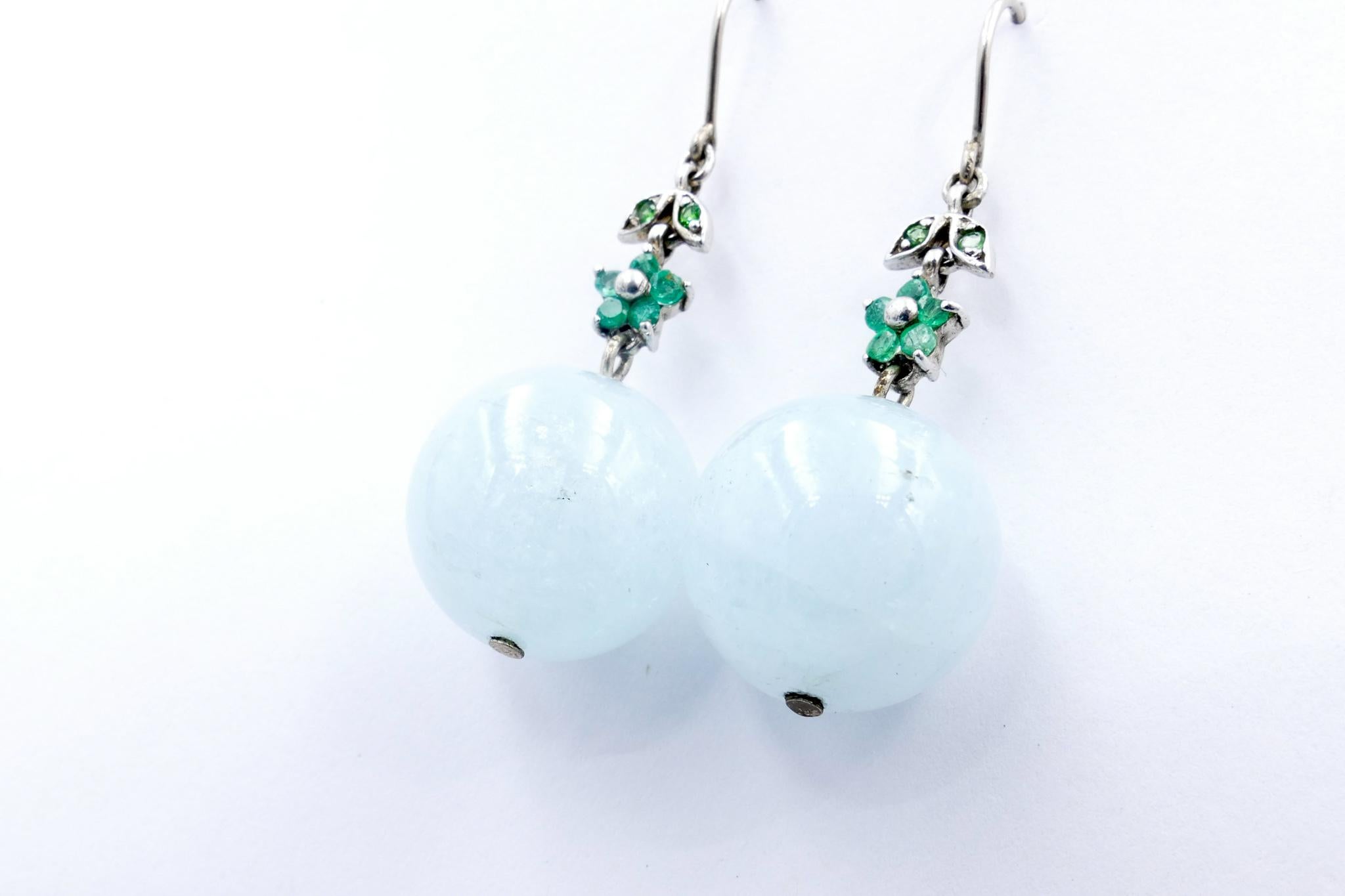 SUCH a pretty Pair of Earrings.
2 large Aquamarine balls sit below a flower pattern of vivid green Emeralds with a further 2 Tsavorite garnets set atop the Emeralds.
The Earrings measure 50mm X 17mm, are set in Silver and have shepherds hook