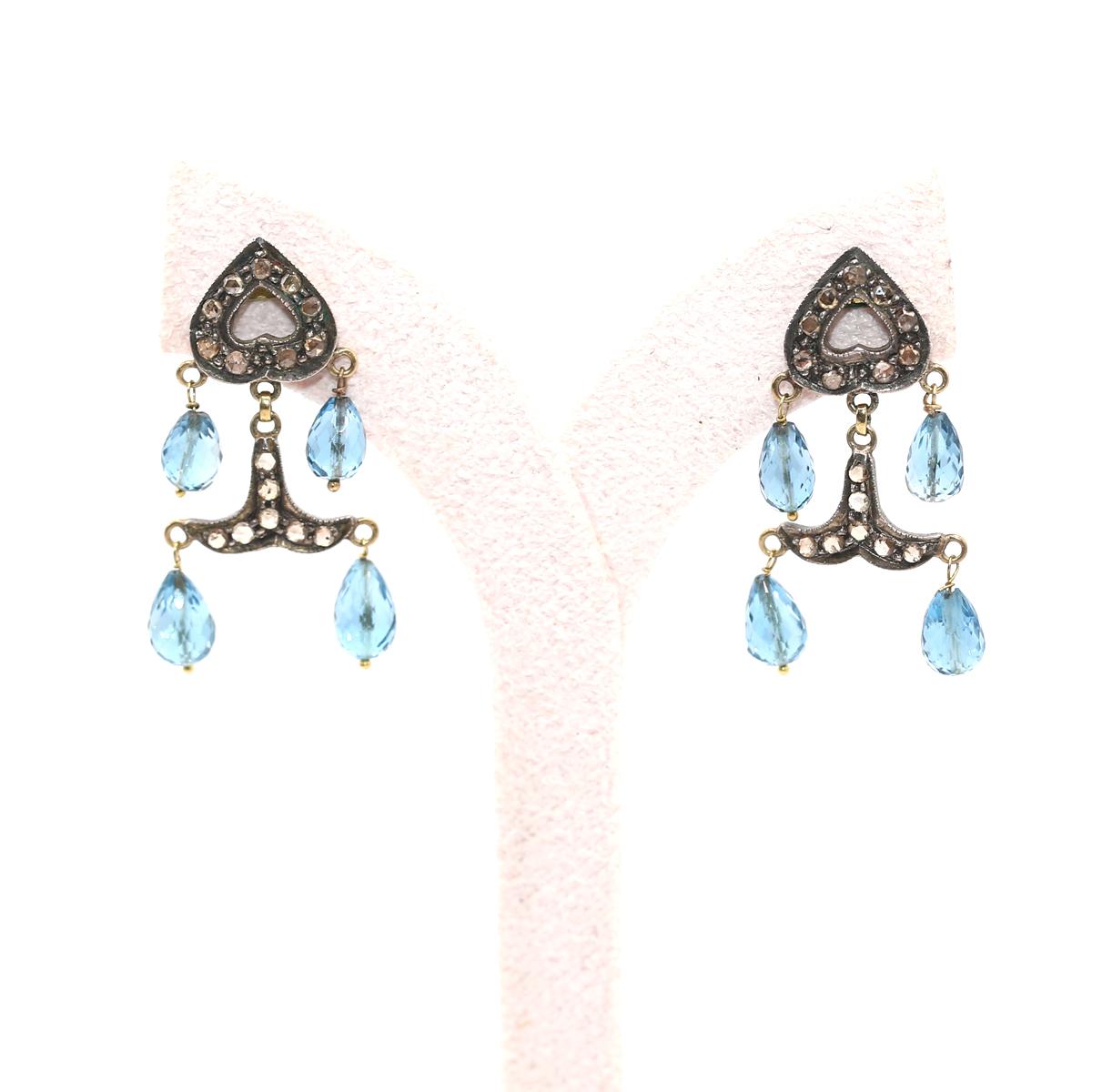 Aquamarine Gold Silver Diamonds Mini Chandelier Earrings. Chandelier Earrings with fine Aquamarine and Diamonds, cast in Silver and Gold.  
The aquamarine shade and color is bright and vivid. All the different parts of this fine jewelry item are