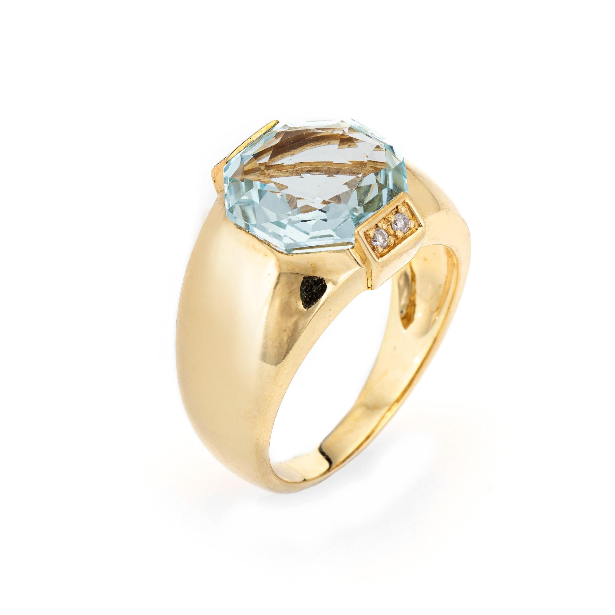 Stylish vintage aquamarine & diamond gypsy ring (circa 1980s to 1990s) crafted in 14 karat yellow gold. 

Hexagonal cut aquamarine measures 12mm (estimated at 4.50 carats), accented with four estimated 0.01 carat diamonds (0.04 carat total estimated