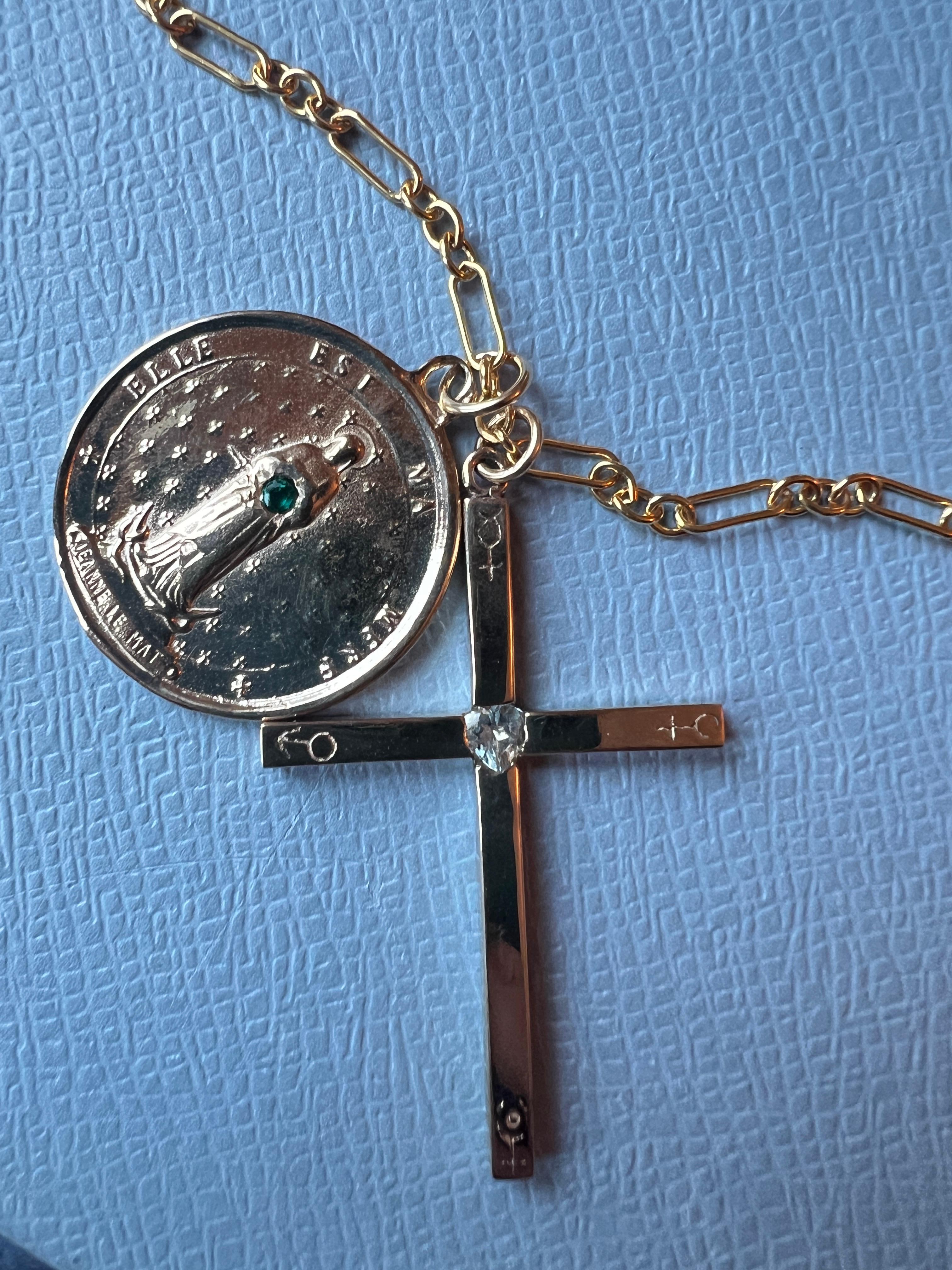 Cross Medal Chain Necklace Aquamarine Heart   

Designer: J Dauphin

Aquamarine Emerald Medal Cross Necklace Chain 

Gem: Aquamarine Herat and Round Emerald

Round Bronze Medal Coin with French Saint Jeanne Le Mat with an Emerald and an Aquamarine