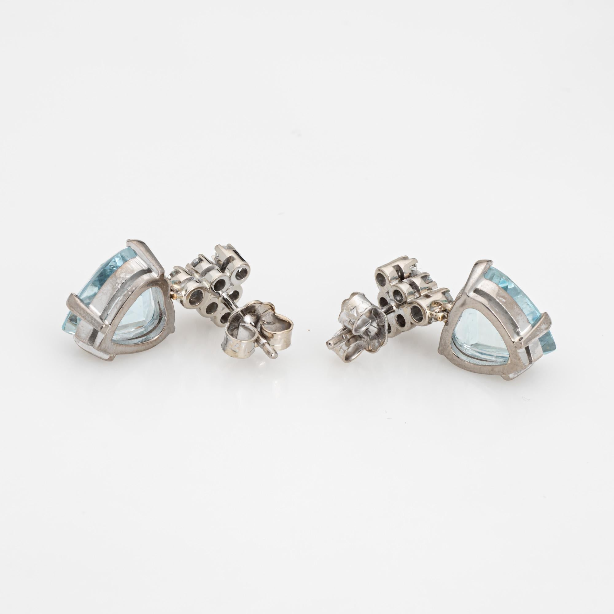 Stylish aquamarine & diamond earrings crafted in 18k white gold (circa 1970s to 1980s).

Heart cut aquamarines measure 10.5mm x 10mm. 12 single cut diamonds total an estimated 0.12 carats (estimated at G-H color and VS2-SI1 clarity). The aquamarines