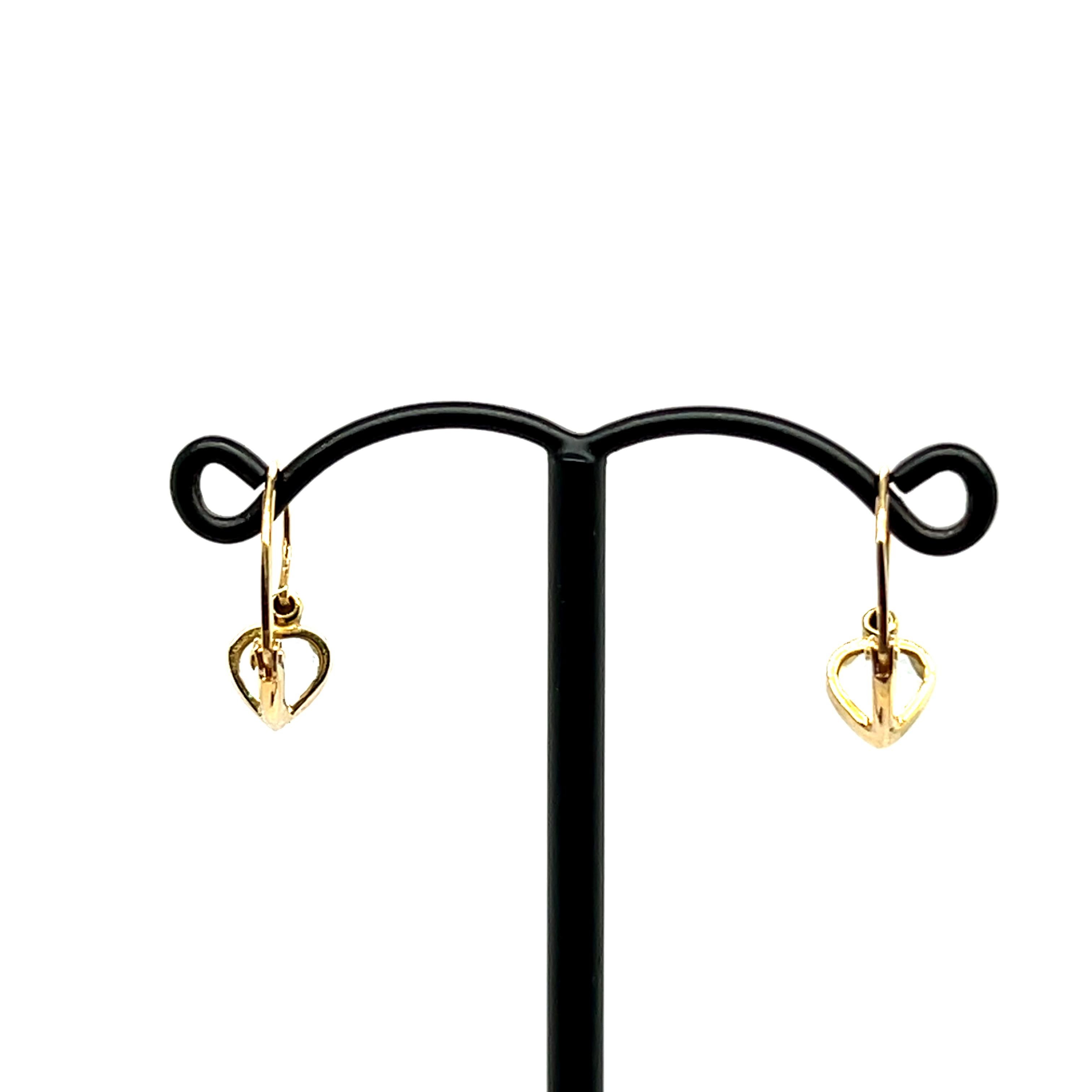 Aquamarine Heart Shape Yellow Gold 18 Carats Earring

Pair of 18 carat yellow gold brooch earrings, elegantly designed for a romantic and timeless look. 
Each earring is adorned with a charming heart-shaped pendant, highlighting the natural