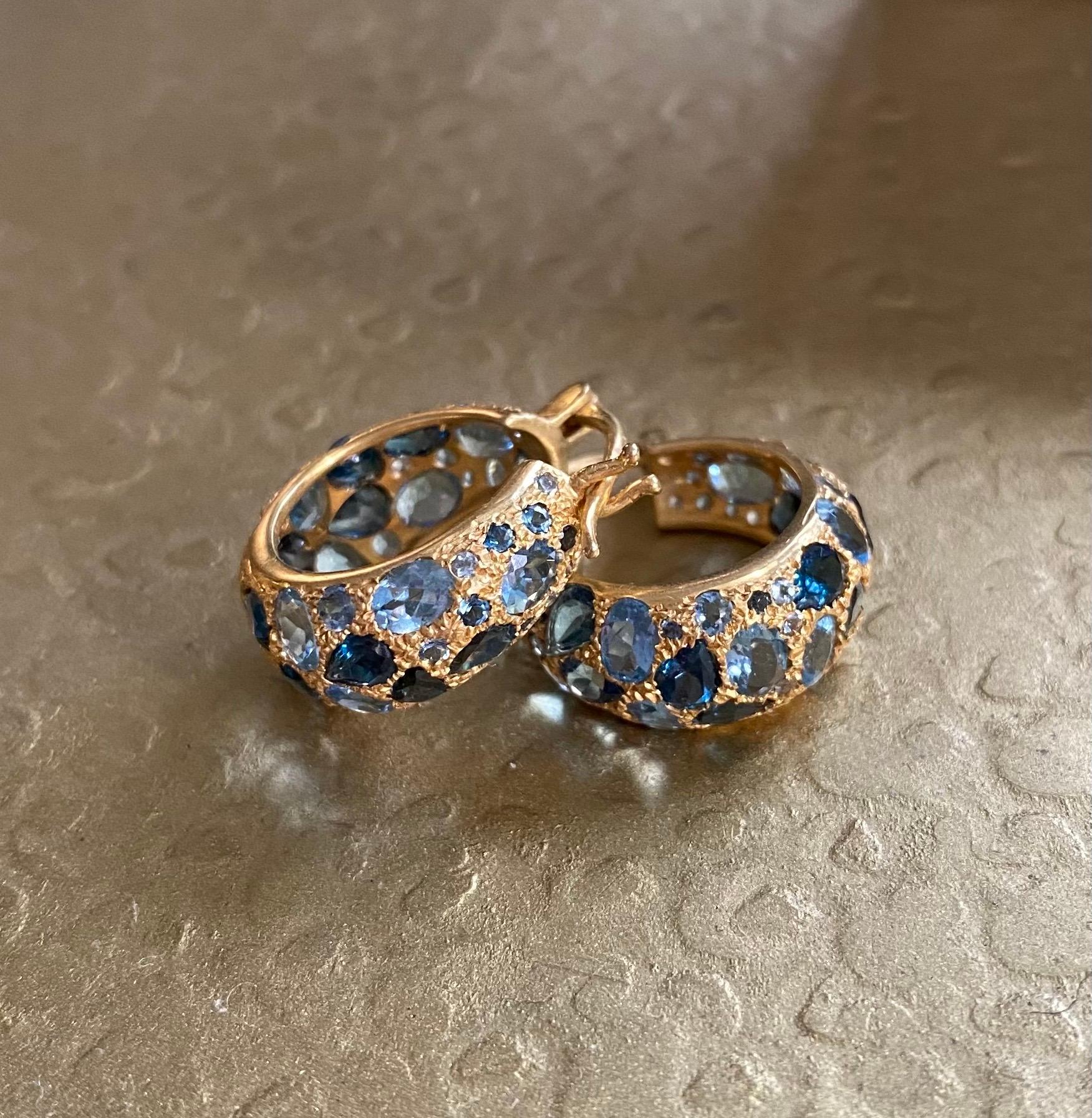 Designed by award winning jewelry designer, Lauren Harper, these Aquamarine and London blue Topaz hoops are set in a warm 18kt matte Gold and are sure to get noticed. Lightweight and secure, these hoops will be your go-to every day earring, even