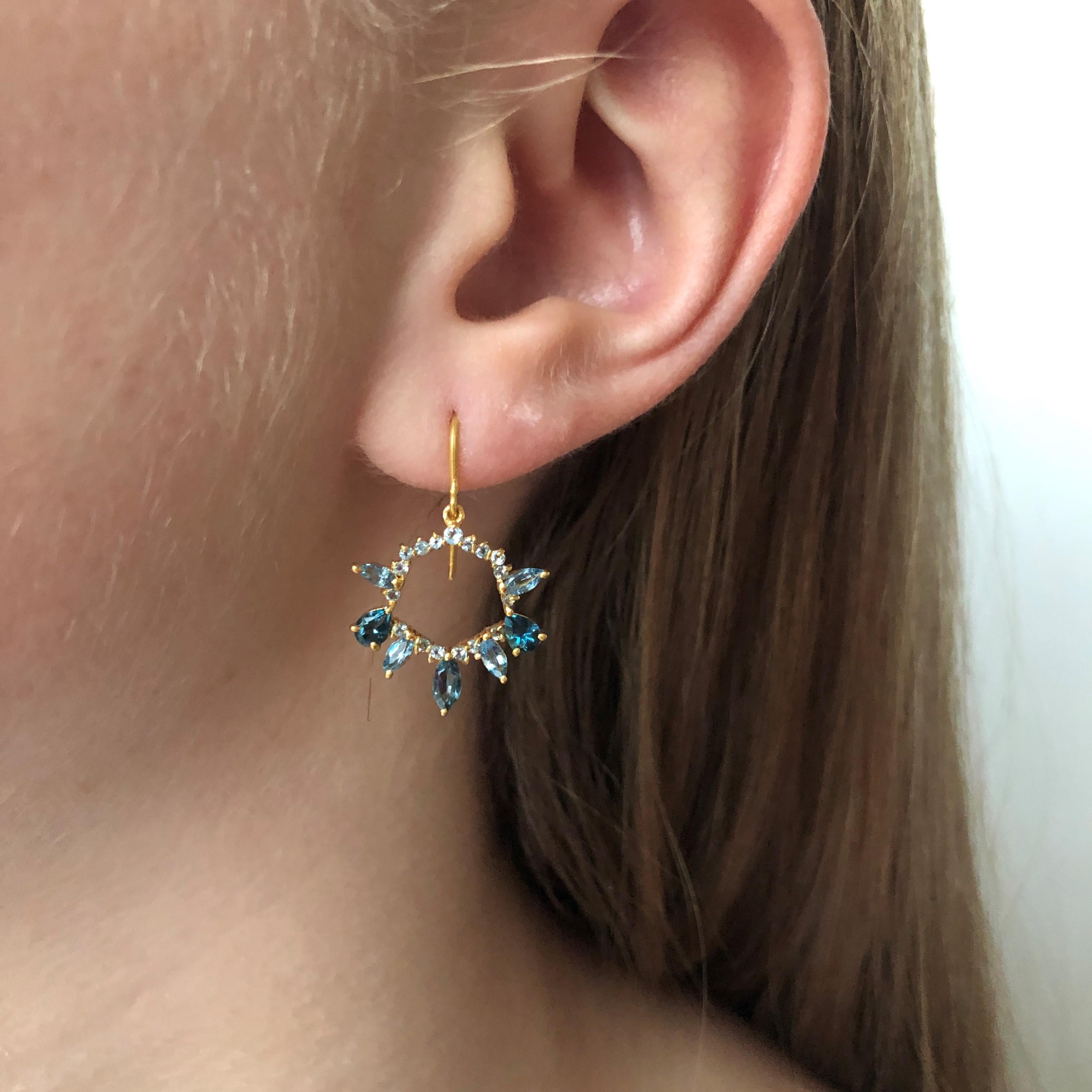Designed by award winning Jewelry Designer, Lauren Harper, these 18kt Solid Gold hand made earrings feature faceted 1.74cts of Aquamarine and London Blue Topaz set in an intricate open Hexagon shaped setting. Lightweight enough for all day wear yet