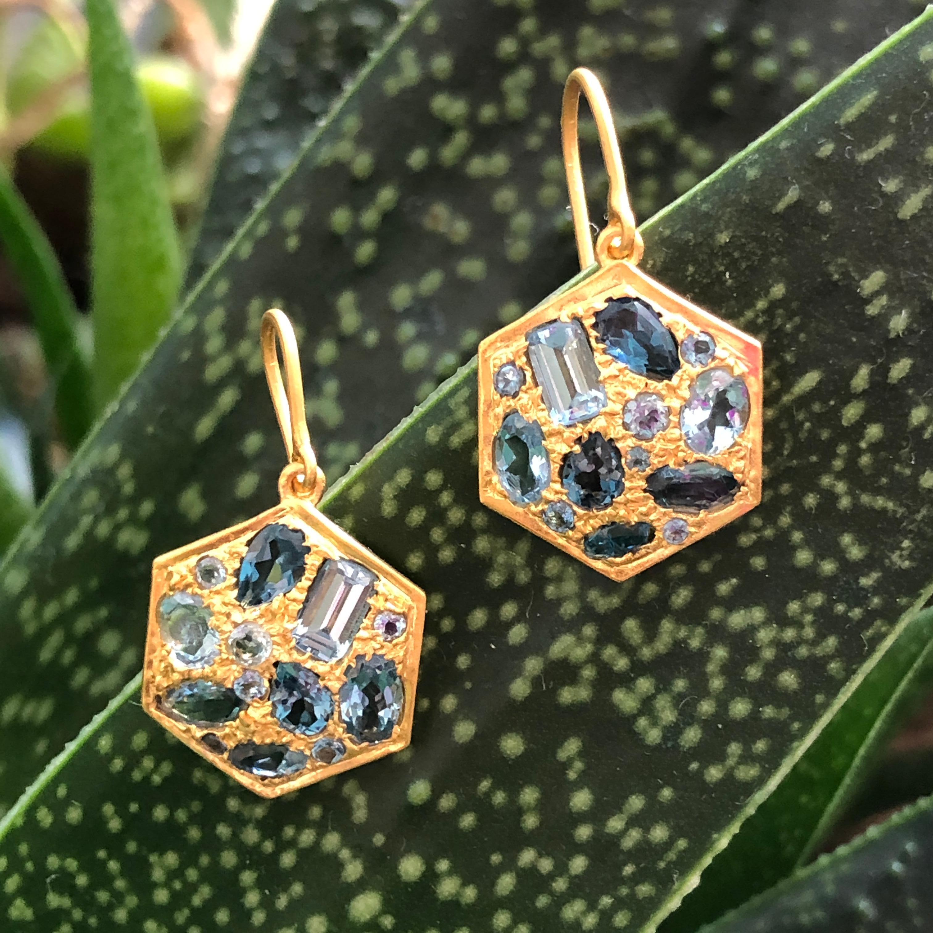 Designed by award winning Jewelry Designer, Lauren Harper, these 18kt Solid Gold hand made earrings feature faceted 2.91 cts of Aquamarine and London Blue Topaz set in an intricate grain setting.  Lightweight enough for all day wear yet special